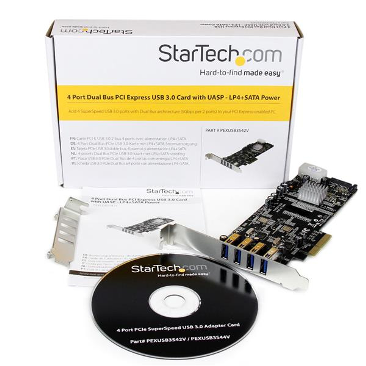 Box mit Computerkomponenten, einer Disc und einer Karte, Text in mehreren Sprachen.