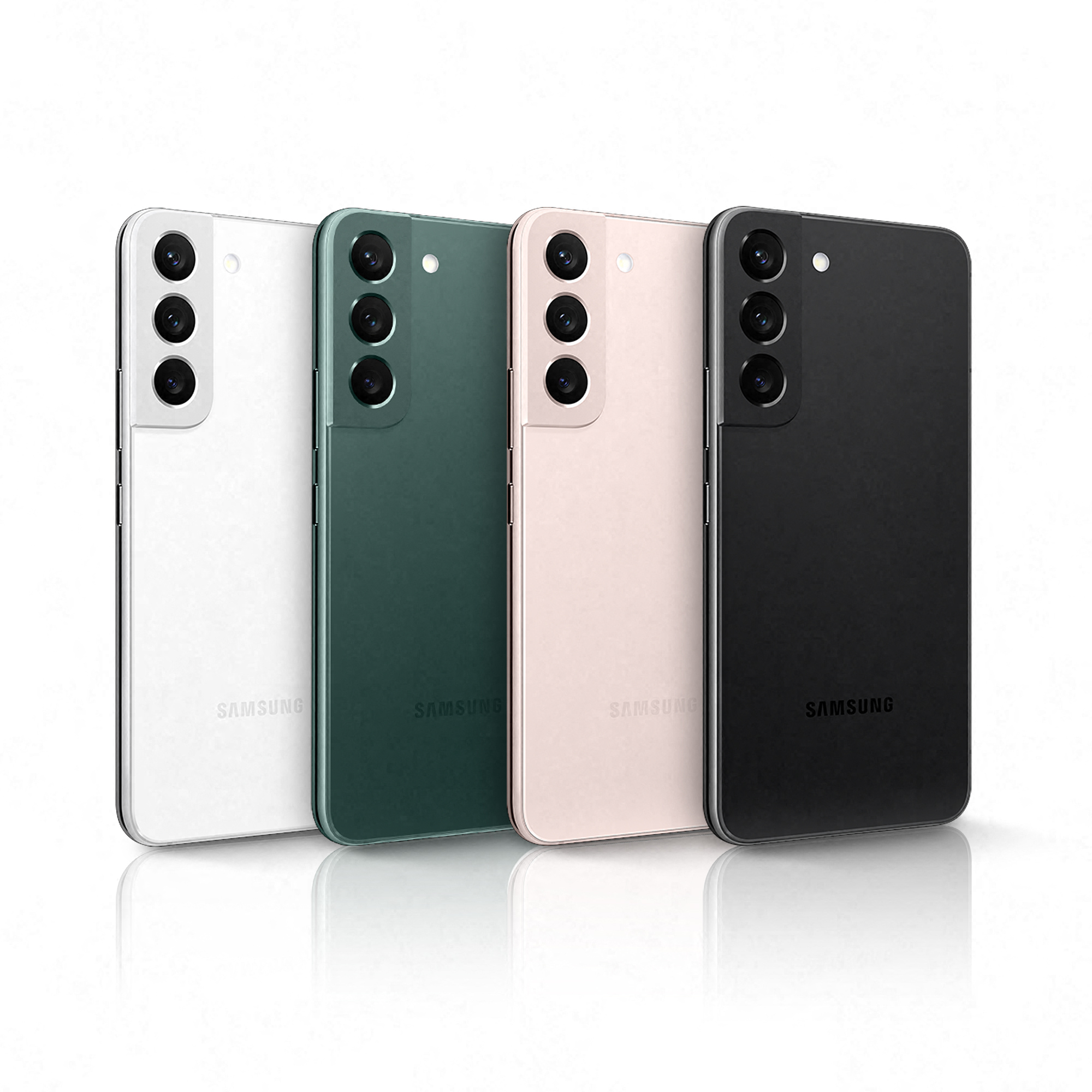 Cuatro teléfonos Samsung en blanco, verde, rosa y negro. Están alineados lado a lado sobre una superficie blanca.