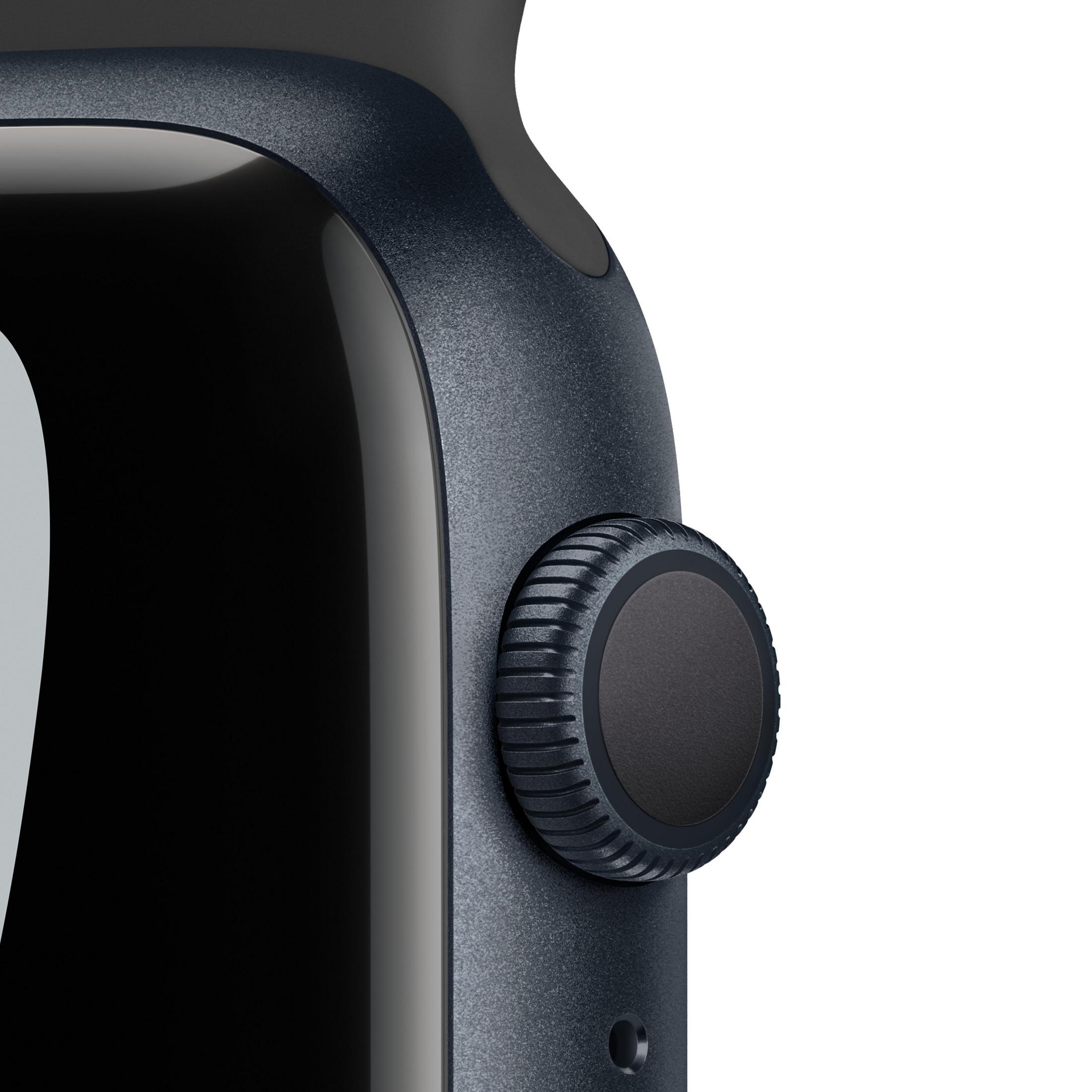 Nahaufnahme der Seite einer Apple Watch in Dunkelblau. Das Zifferblatt ist dunkel.