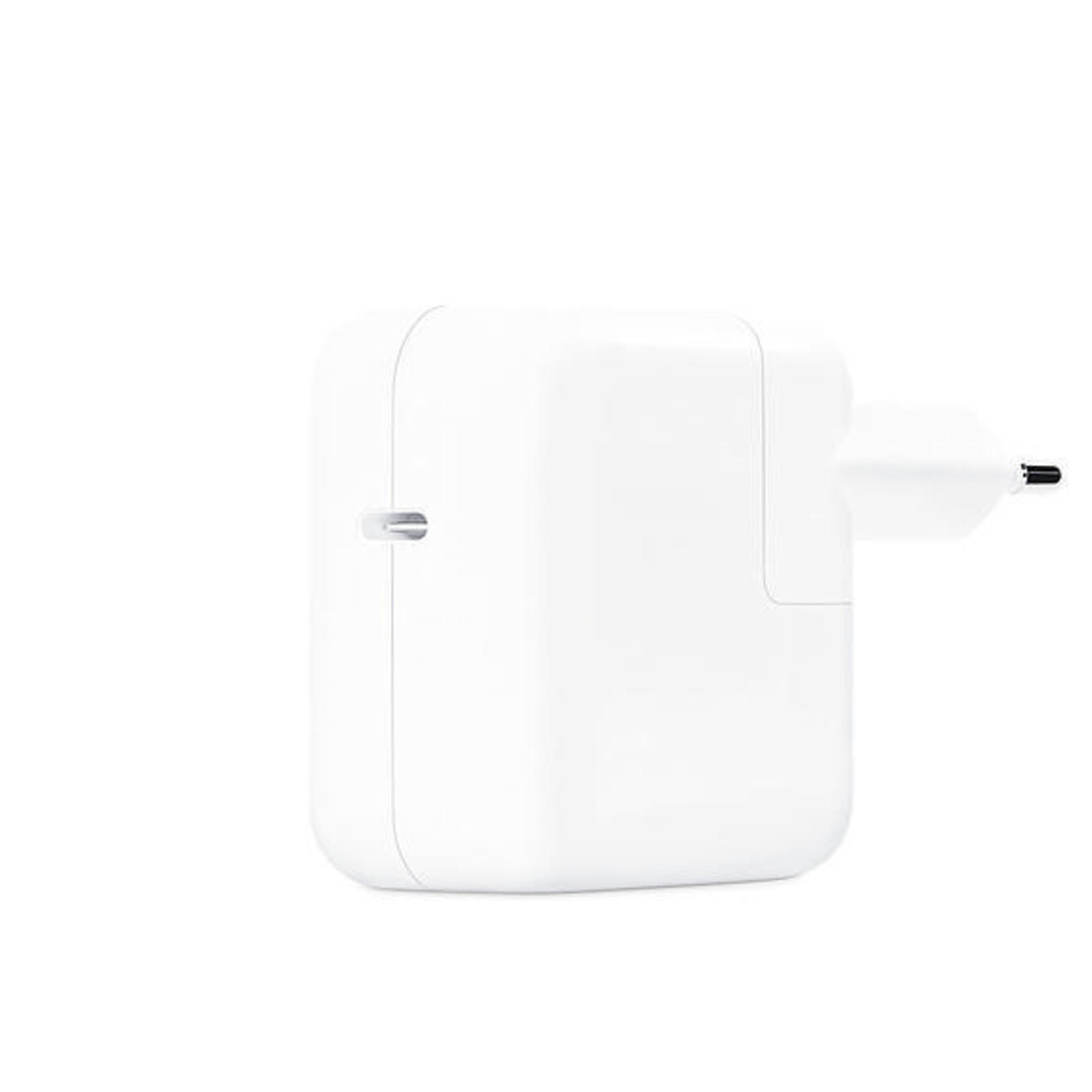 Adattatore di alimentazione Apple bianco con spina. Design semplice e pulito.