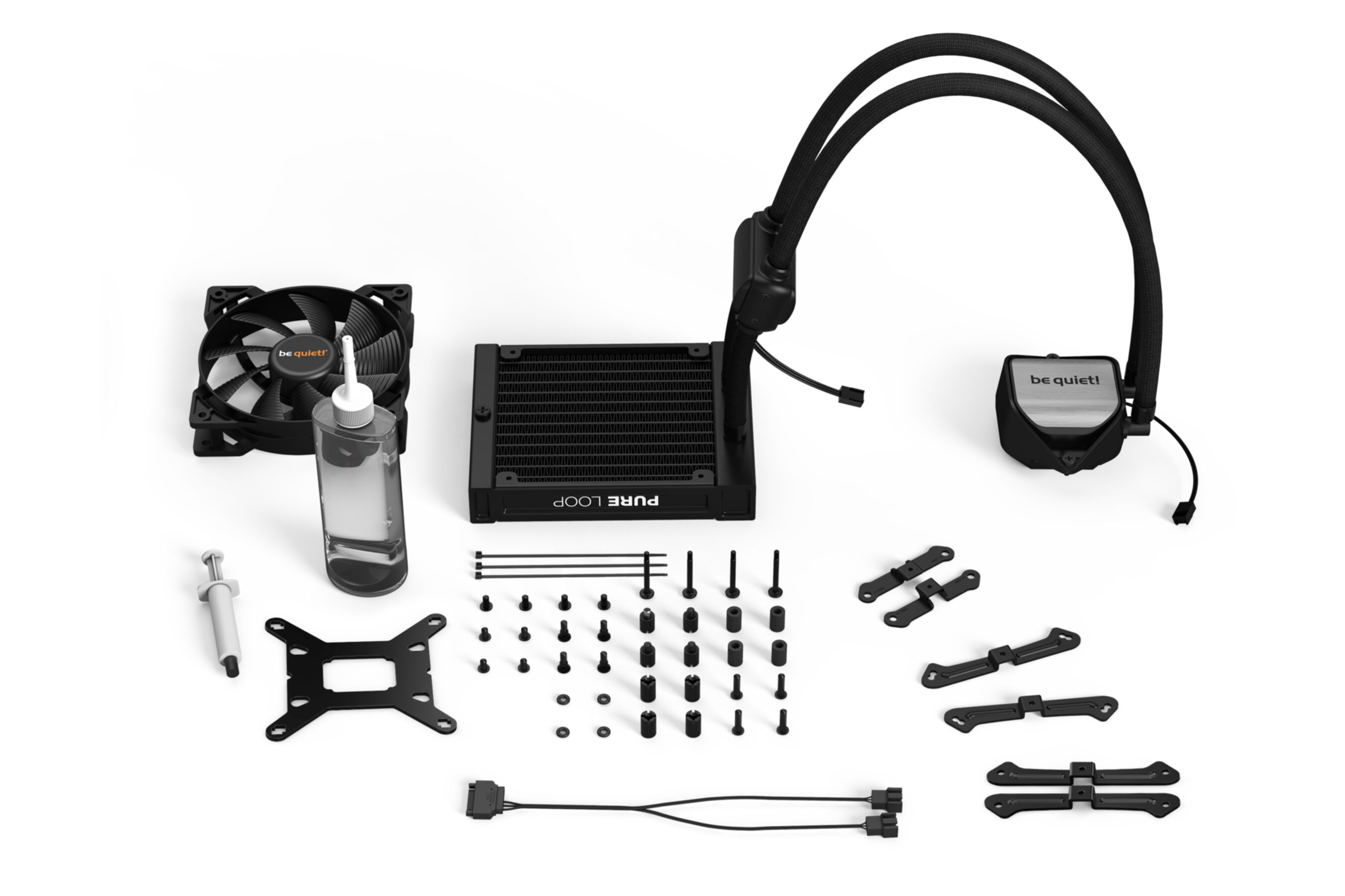 Elementy komputera, w tym wentylator, chłodnica, ciecz i inne akcesoria są widoczne.