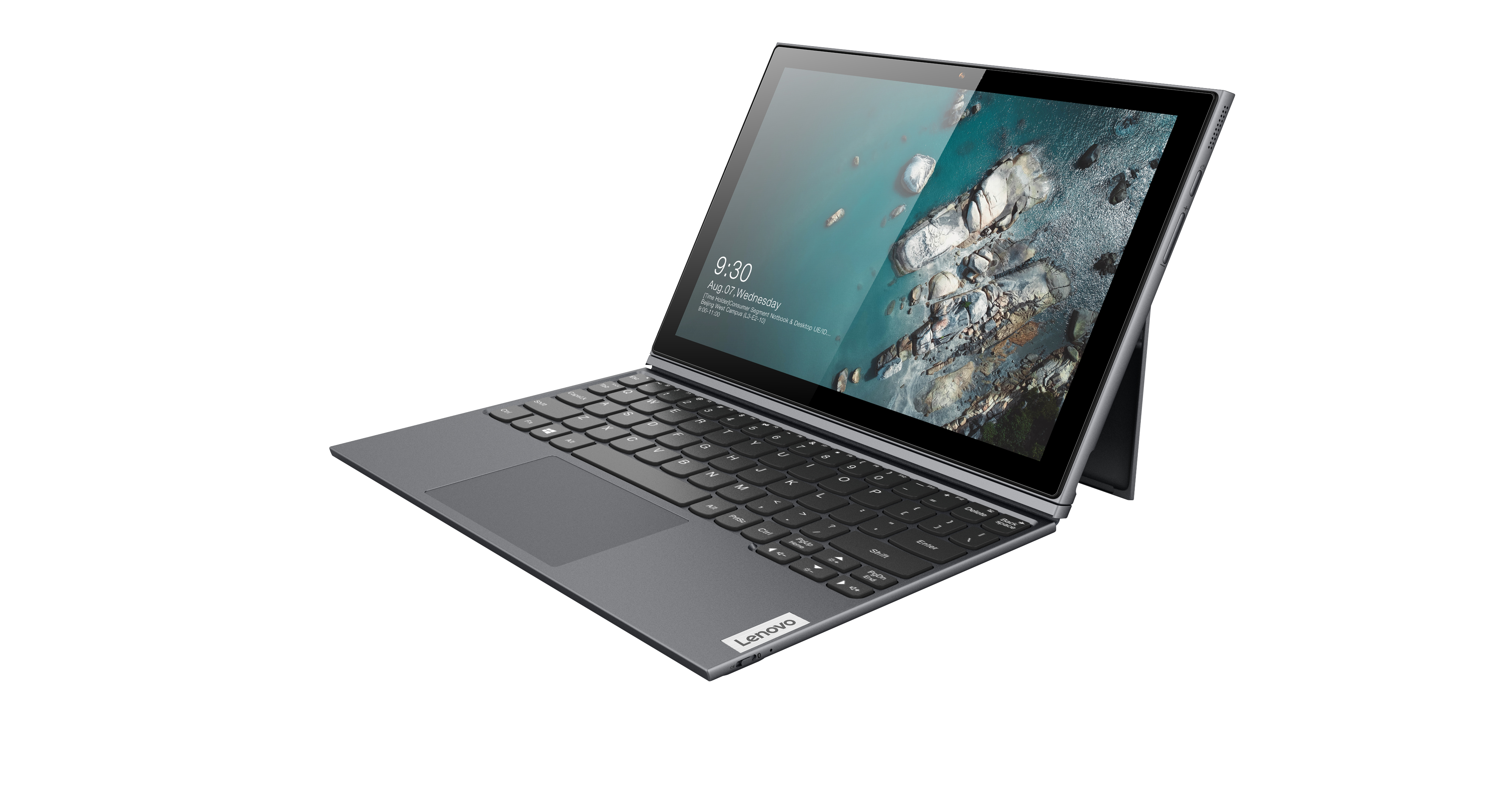 Tablet Lenovo grigio, tastiera collegata, schermo mostra scena paesaggistica con testo.