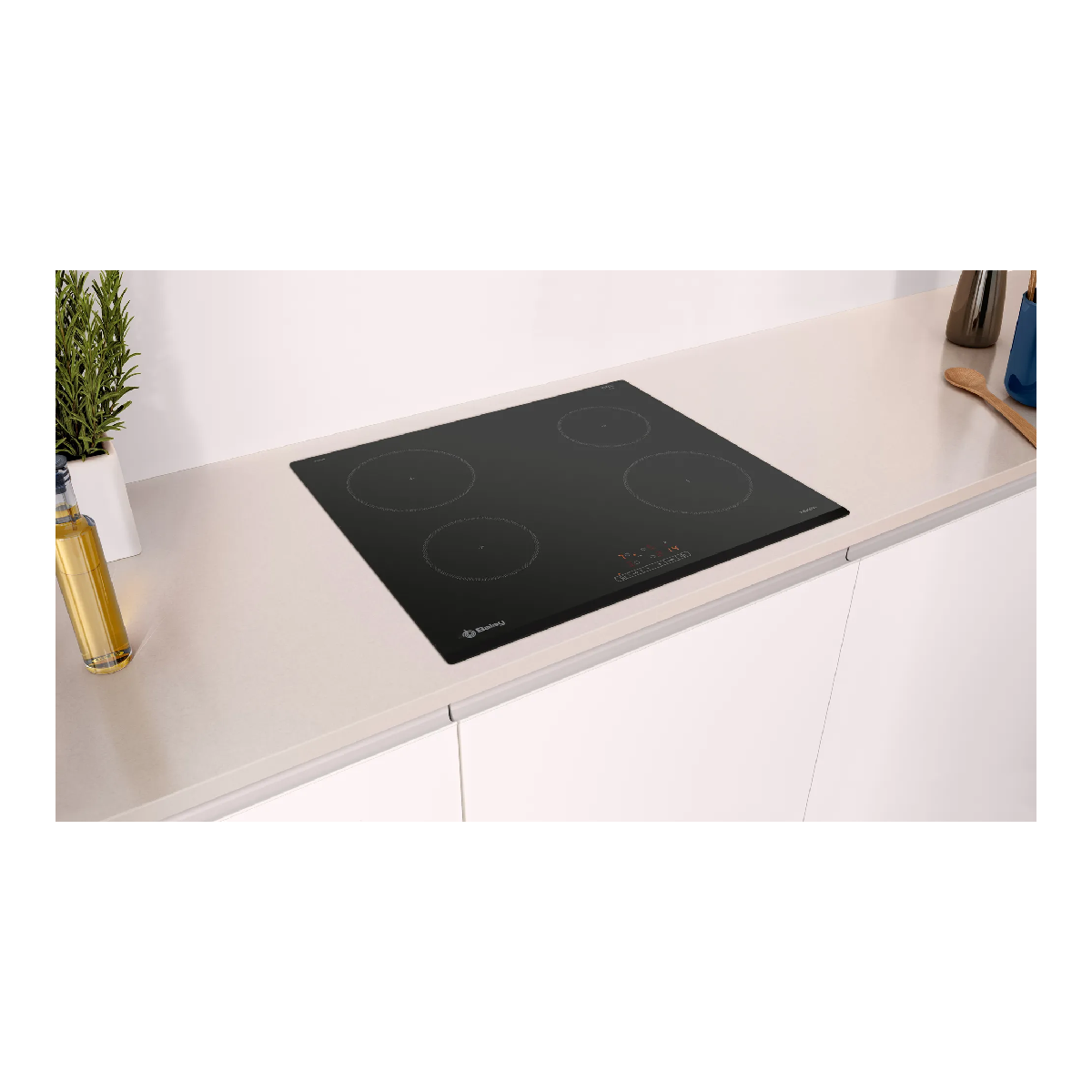 Black induction cooktop with four cooking zones, on a white countertop.