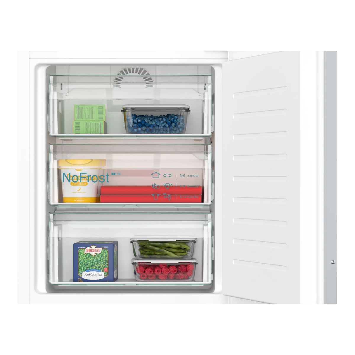 Otwarta zamrażarka z szufladami z mrożoną żywnością: borówki, lody i warzywa.