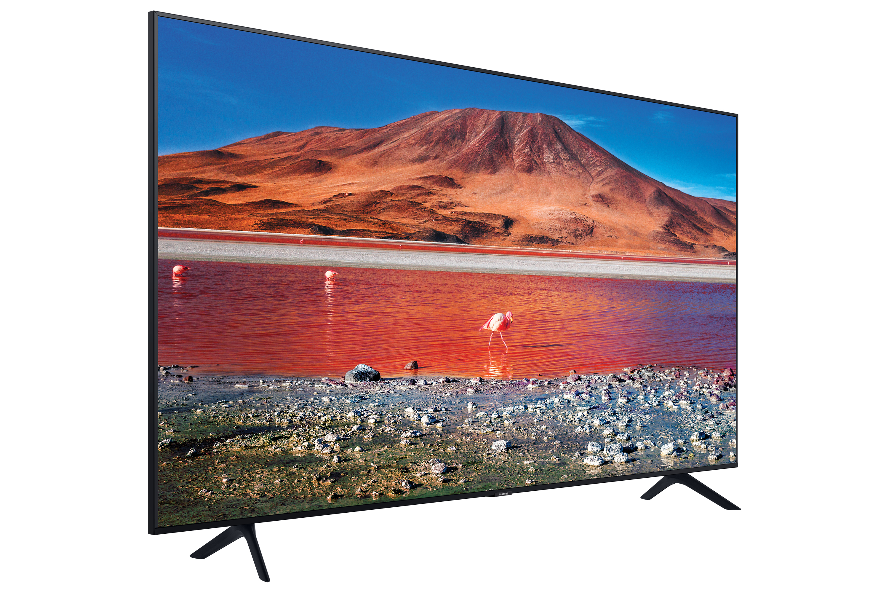 TV mostra lago rosso, montagne e fenicotteri sotto cielo blu.