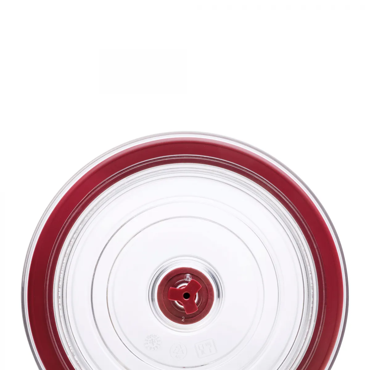 Primer plano de una tapa transparente con borde rojo y mecanismo central rojo.