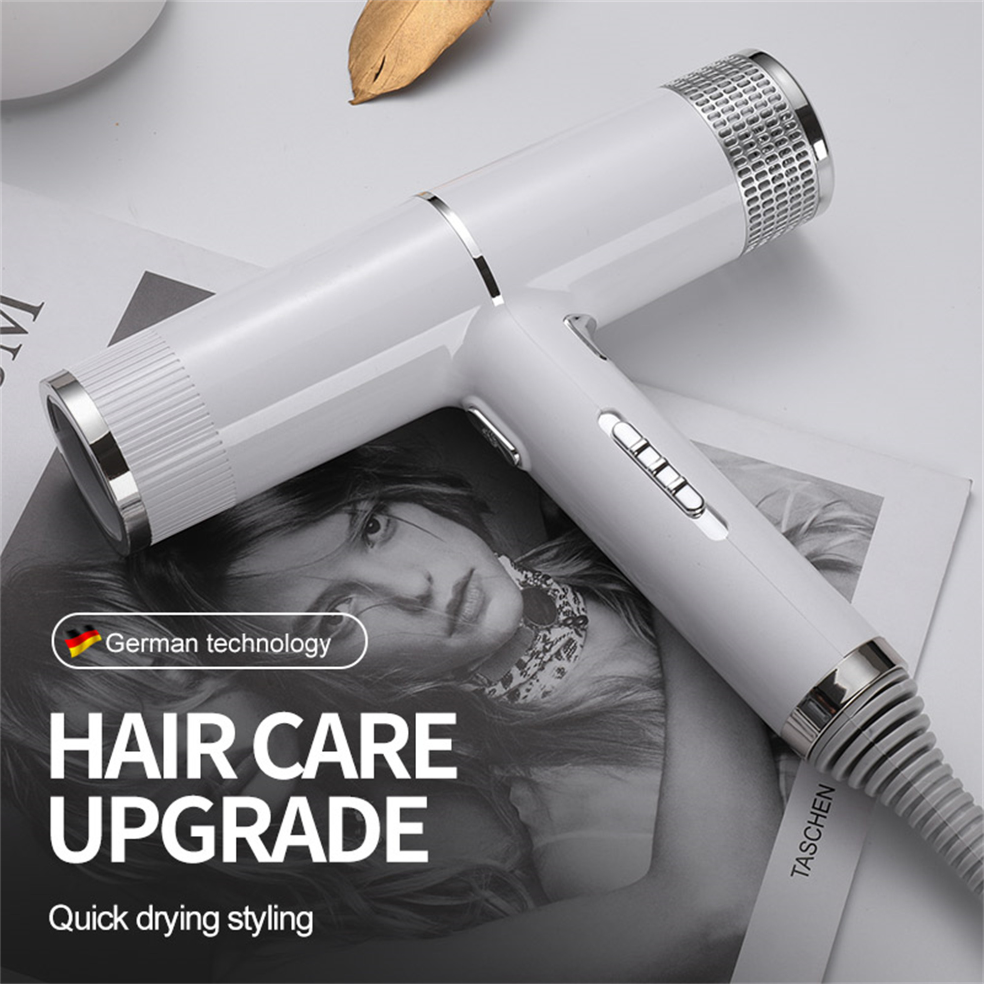 Weißer und silberner Haartrockner mit dem Text 'Hair Care Upgrade' auf einer Zeitschrift.