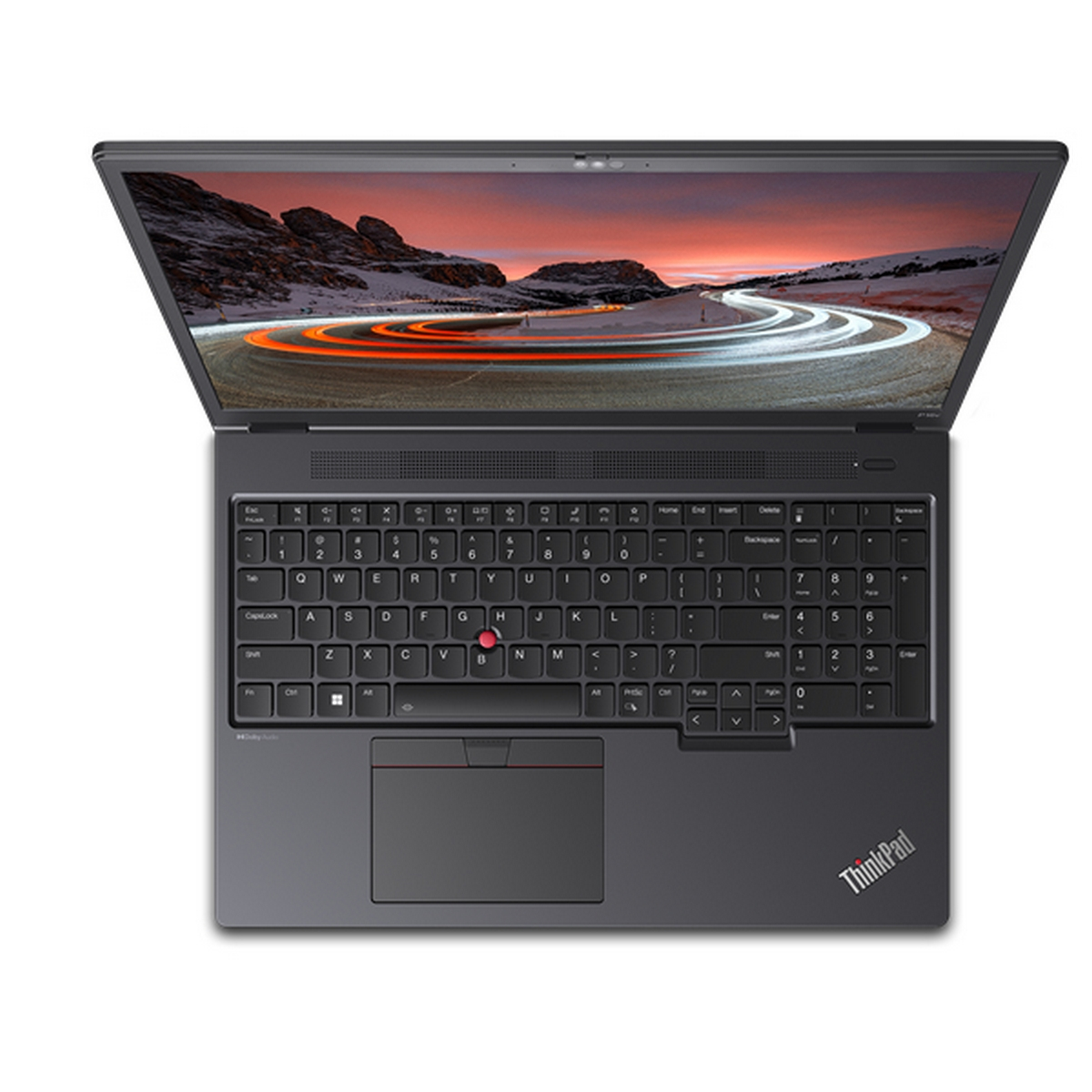 Laptop aperto con tastiera, touchpad e schermo che mostra una strada di montagna. Logo ThinkPad visibile.
