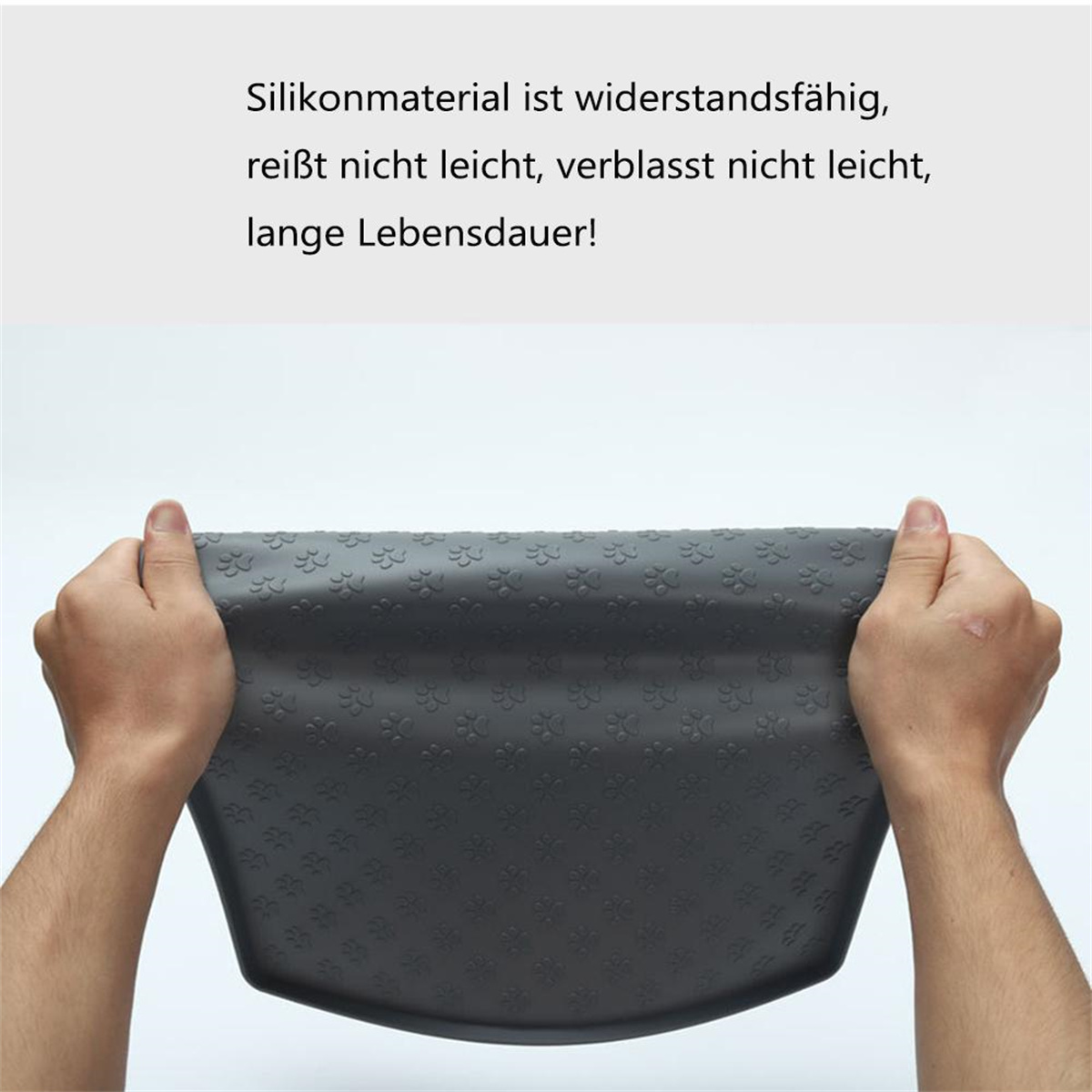 Hände dehnen eine graue Silikonmatte mit Blumenmustern. Der Text besagt, dass sie widerstandsfähig und langlebig ist.