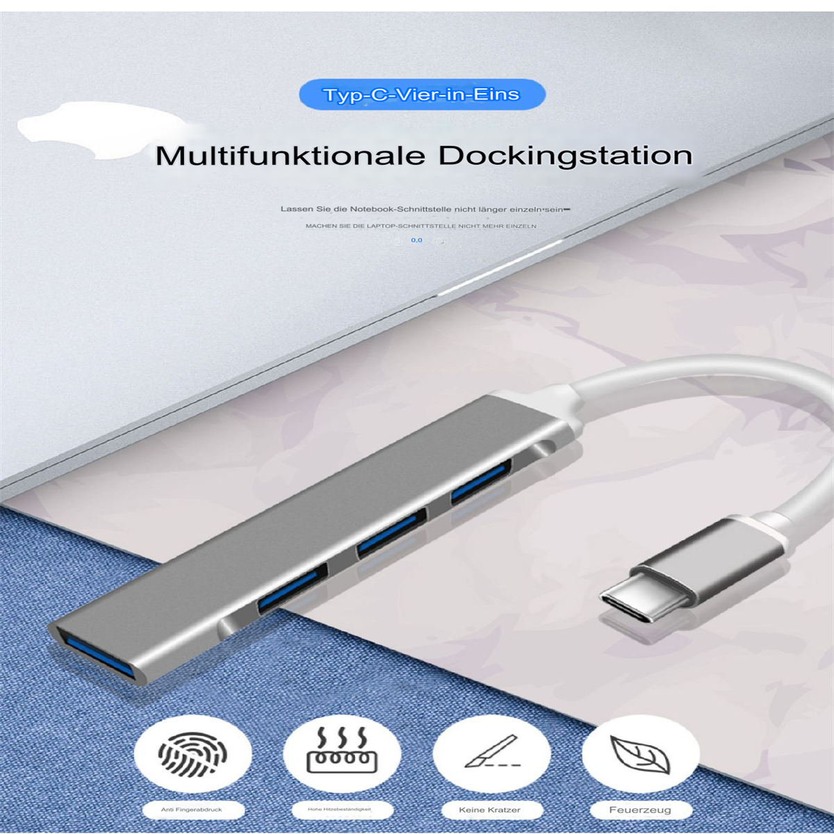 Silberne Dockingstation mit USB-Anschlüssen, an einen Laptop angeschlossen.