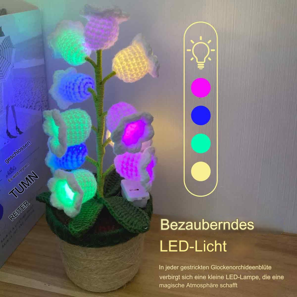 Künstliches Blumenarrangement mit LED-Lichtern. Mehrfarbige Lichter in jeder Blume. Topf am Boden.
