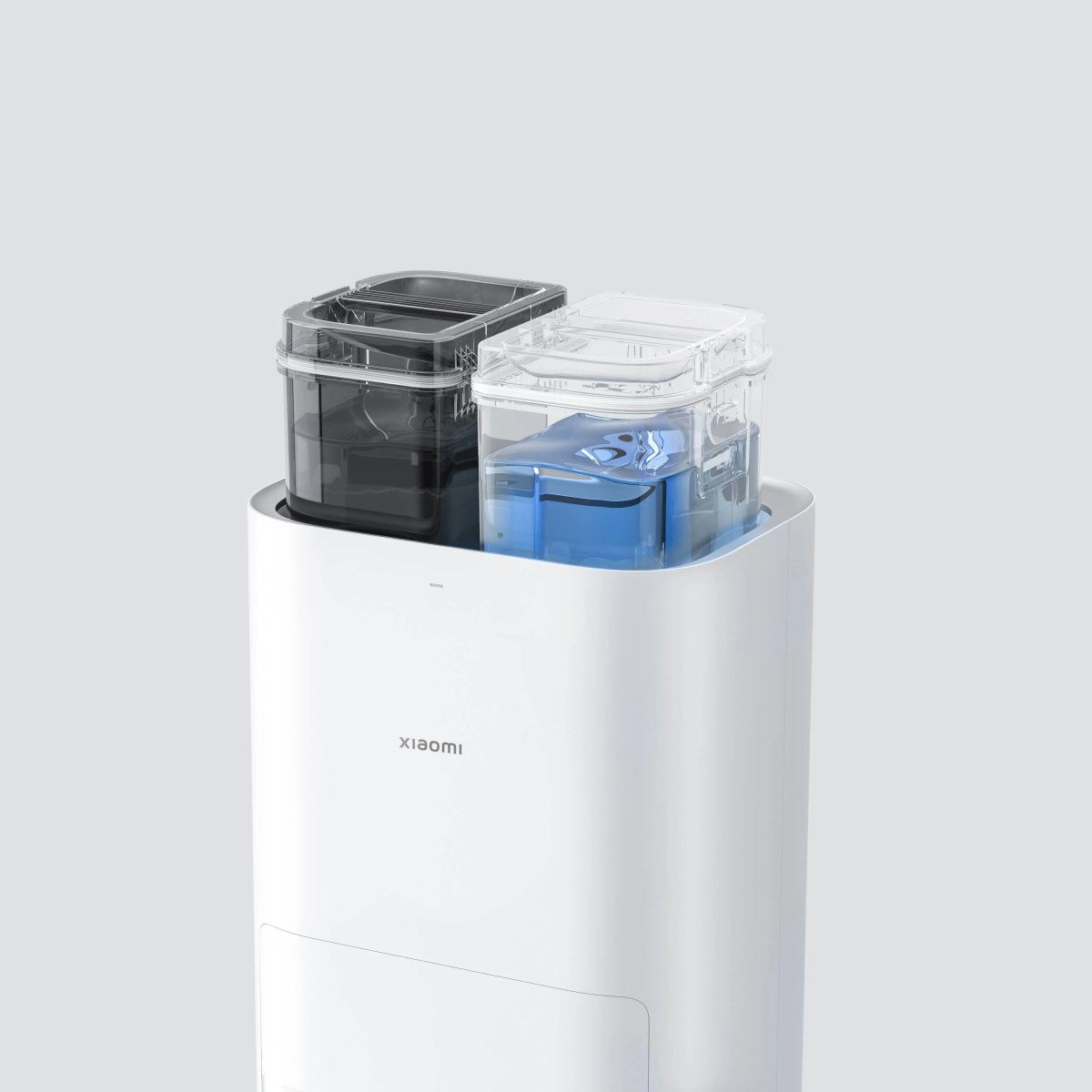 Białe i czarne urządzenie z dwoma pojemnikami, jednym przezroczystym i jednym czarnym, na górze.