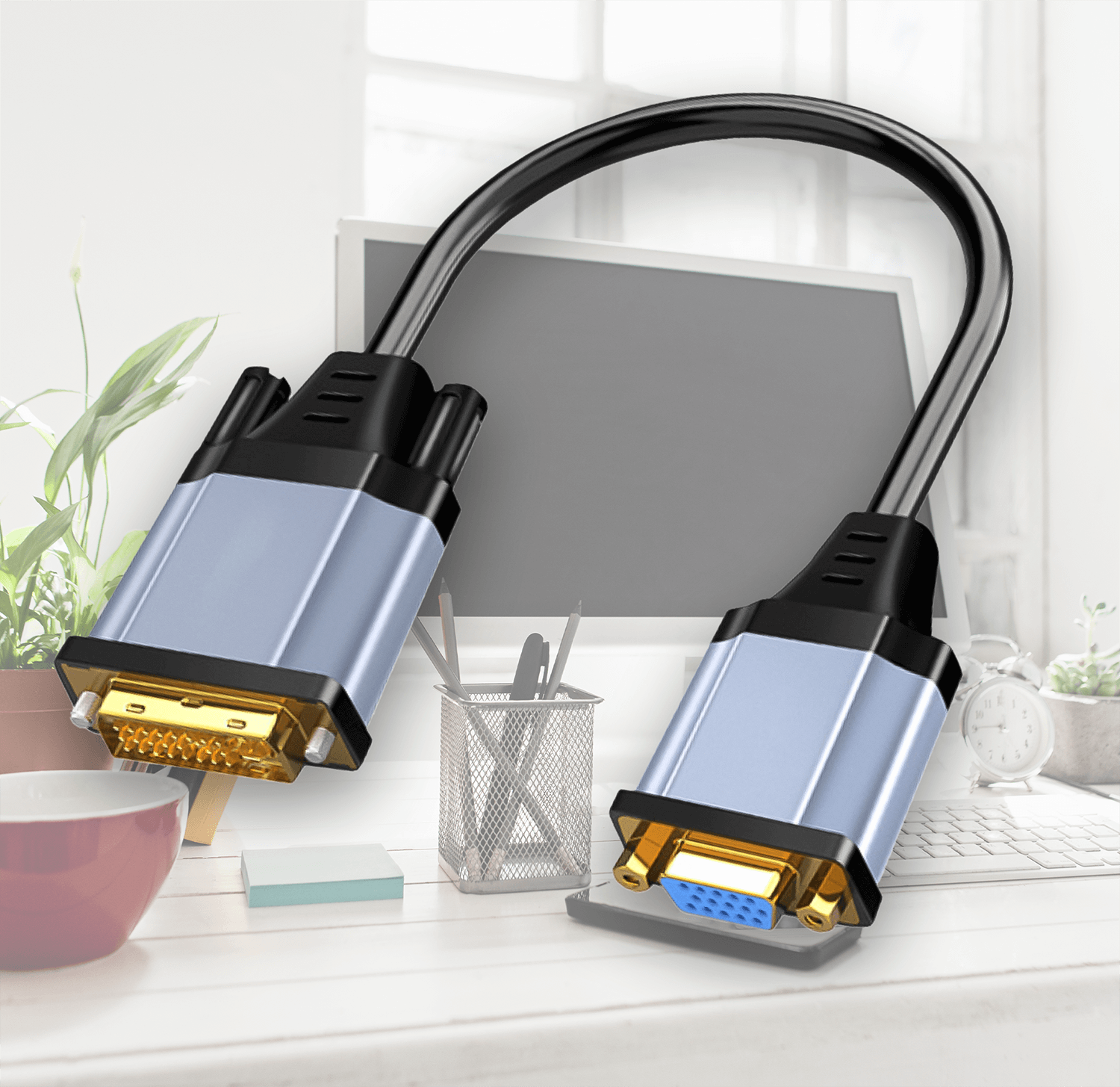 Kabel komputerowy z dwoma złączami. Srebrny i niebieski. Na stole, białe tło.