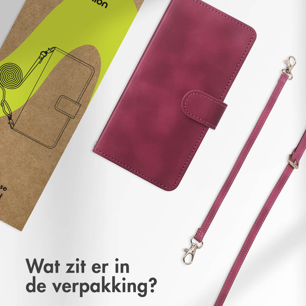 Burgunderfarbene Handyhülle mit Riemen und Verpackung. Die Verpackung fragt: 'Was ist in der Box?'