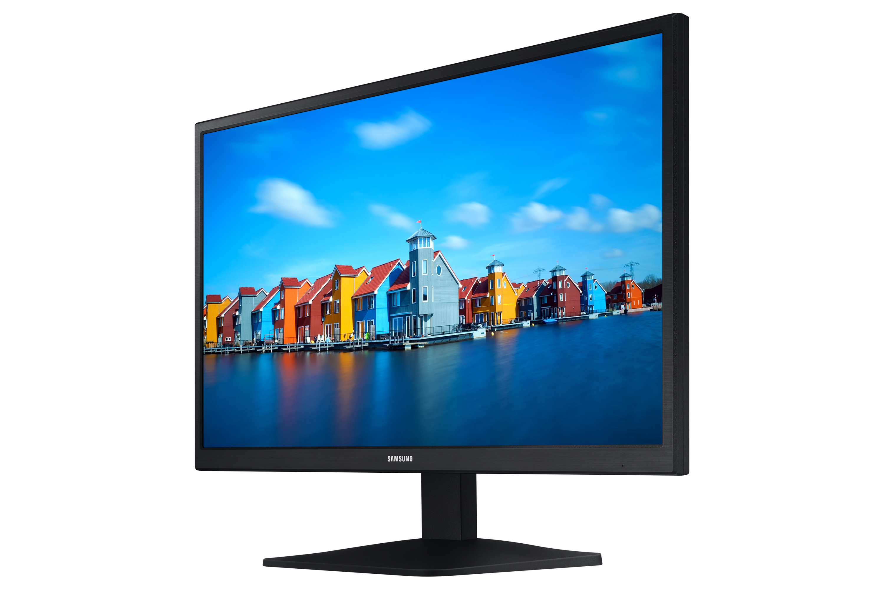 Schwarzer Samsung-Computermonitor, der bunte Häuser an einem See mit blauem Himmel zeigt.