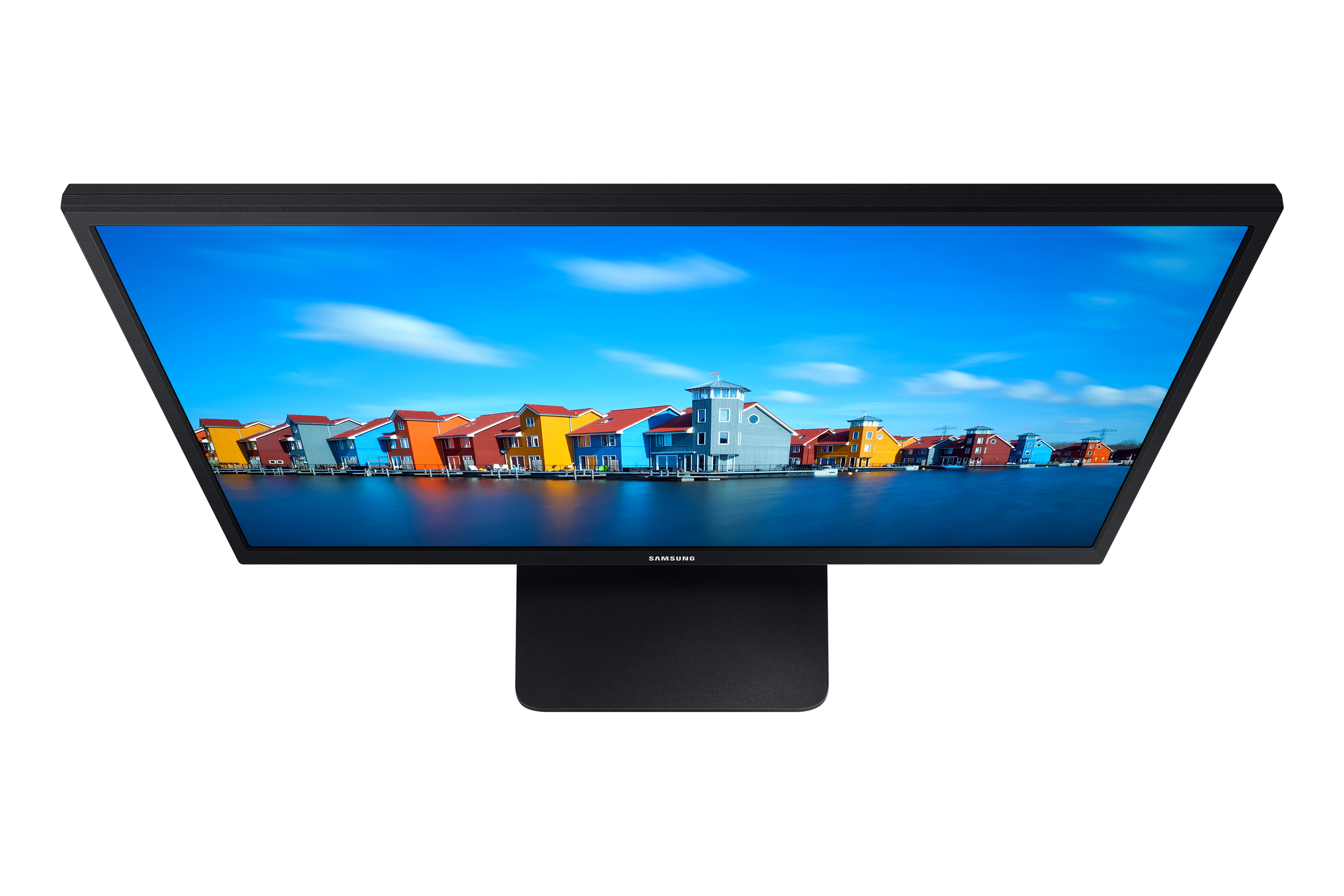 Samsung-Monitor, Draufsicht, zeigt eine farbenfrohe Szene von Häusern an einem blauen See.