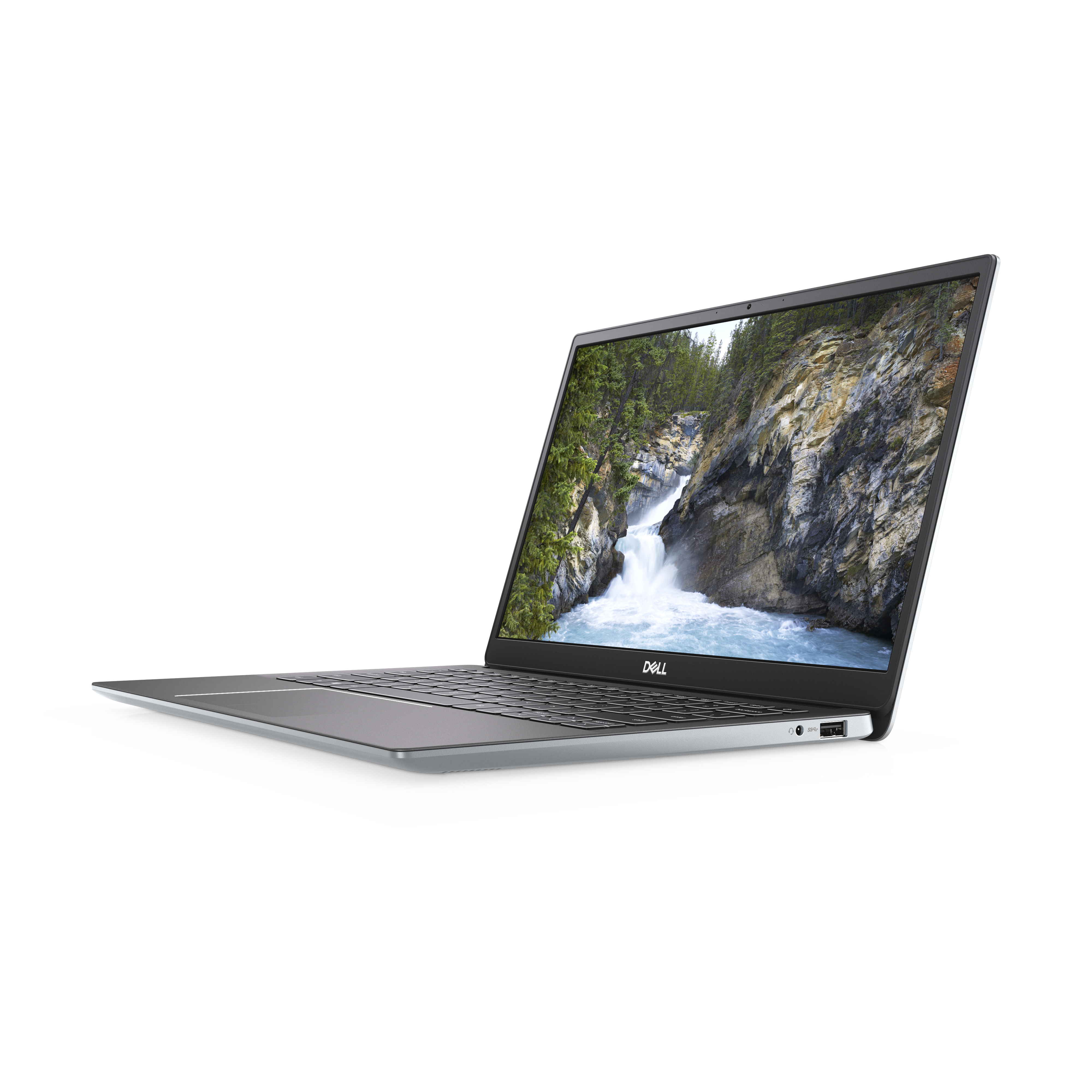 Un laptop argentato è aperto su sfondo bianco. Mostra una scena di cascata.