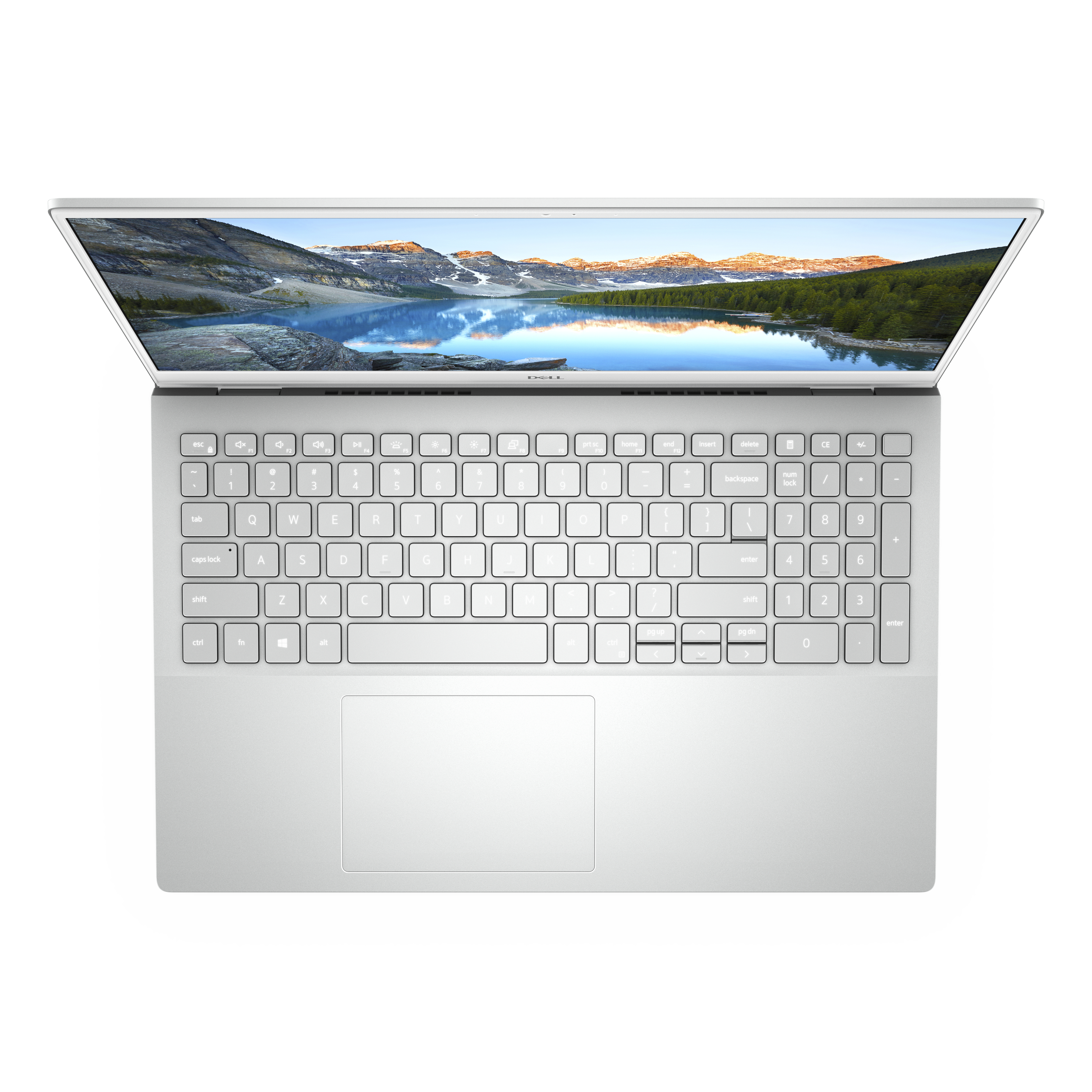 Laptop argento aperto con un paesaggio sullo schermo e tastiera bianca. Il laptop è su una superficie bianca.