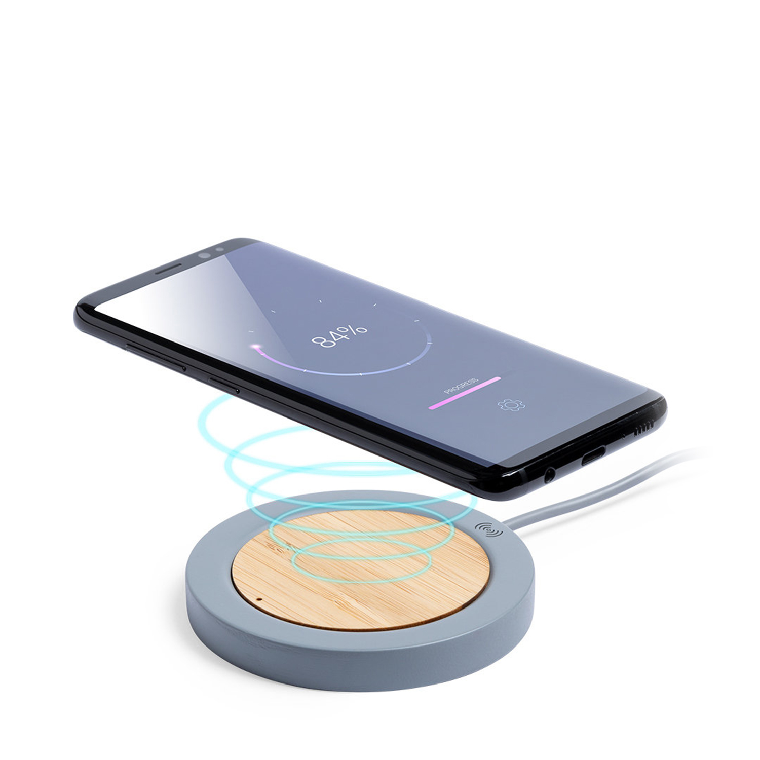 Base di ricarica wireless con telefono sopra, che mostra la ricarica. Il pad è grigio e legno.