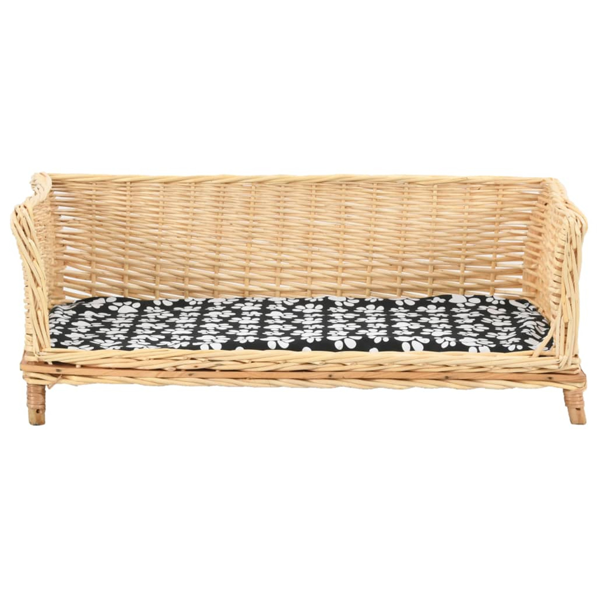 Ein Katzenbett aus Weide mit einem schwarz-weiß gemusterten Kissen.
