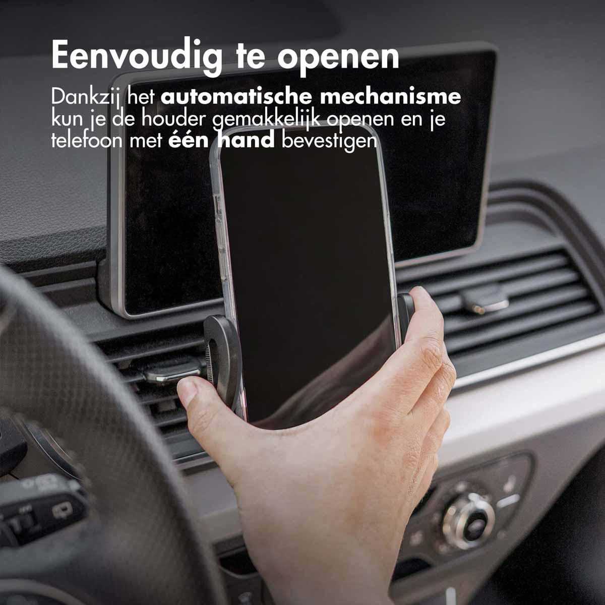 A hand putting a phone into a black phone holder in a car's dashboard.