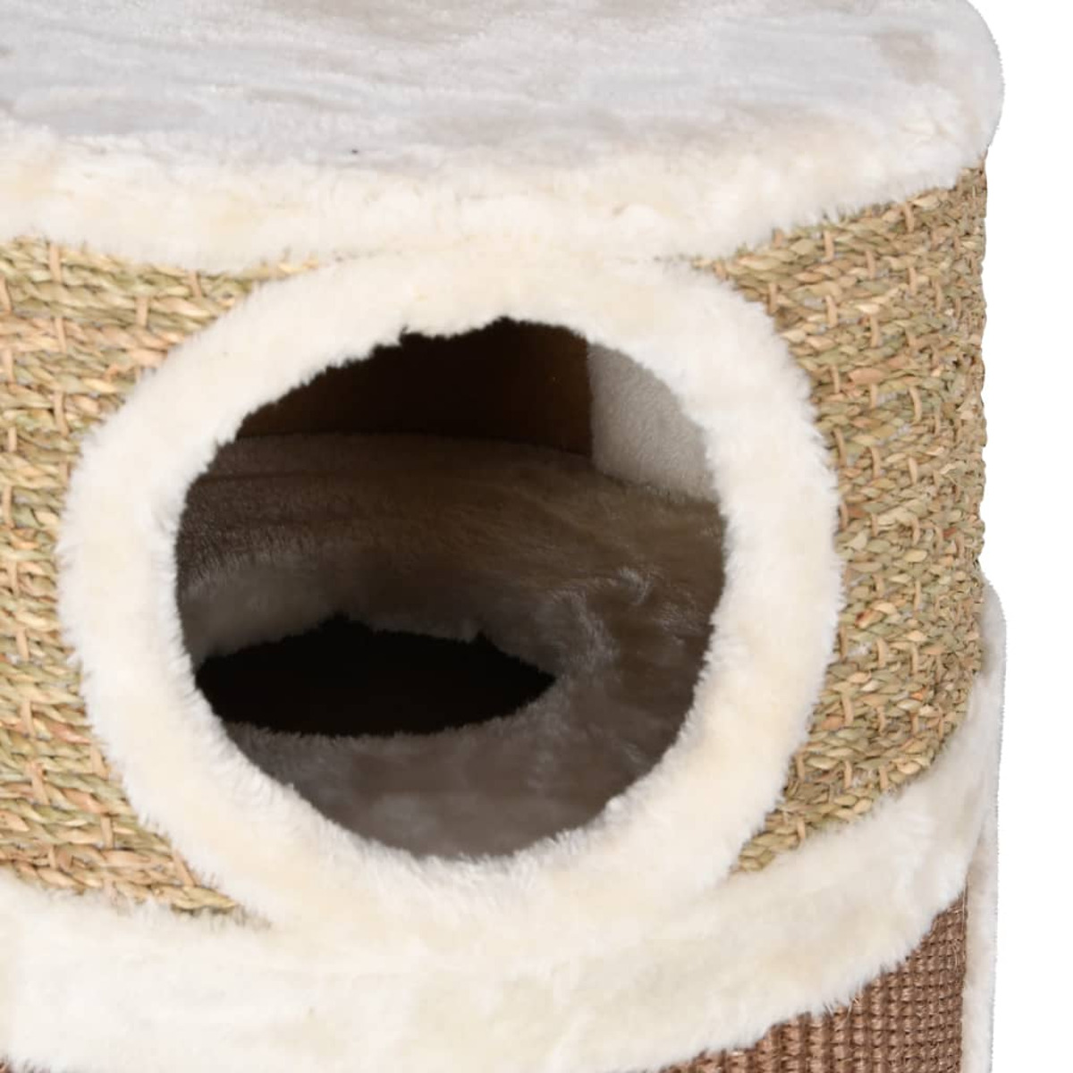 Nahaufnahme eines Katzenbaums mit runder Öffnung und flauschigem Innenraum.