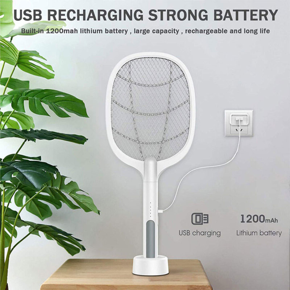 Matamoscas eléctrico blanco y gris, con soporte de carga y planta. Fondo blanco.