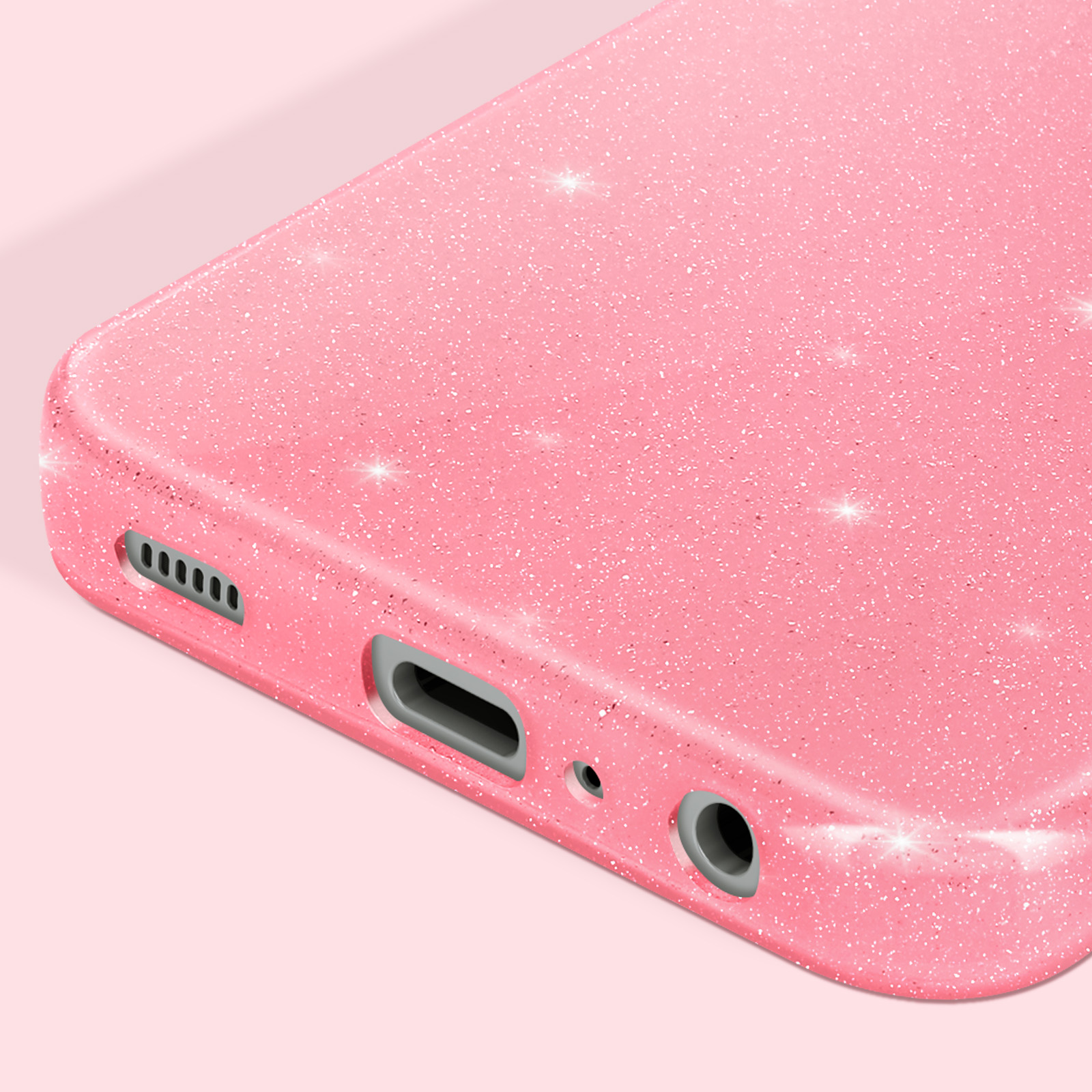 Primo piano di una custodia rosa per telefono con piccoli punti bianchi e riflessi scintillanti.