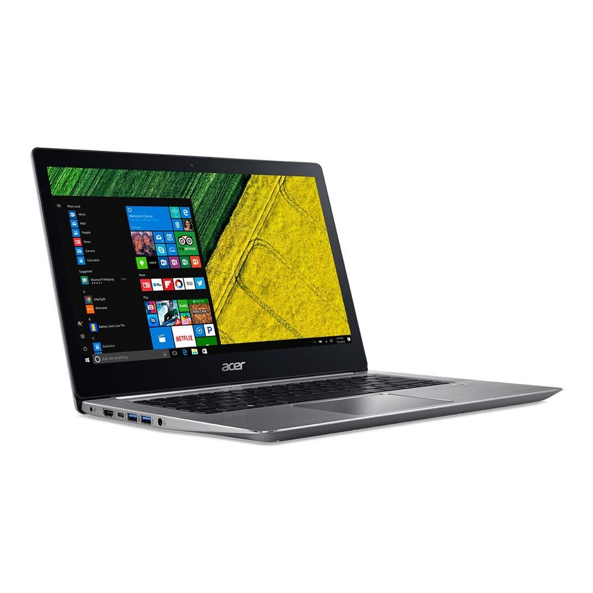Laptop argentato, aperto, su sfondo bianco. Lo schermo mostra il desktop di Windows.