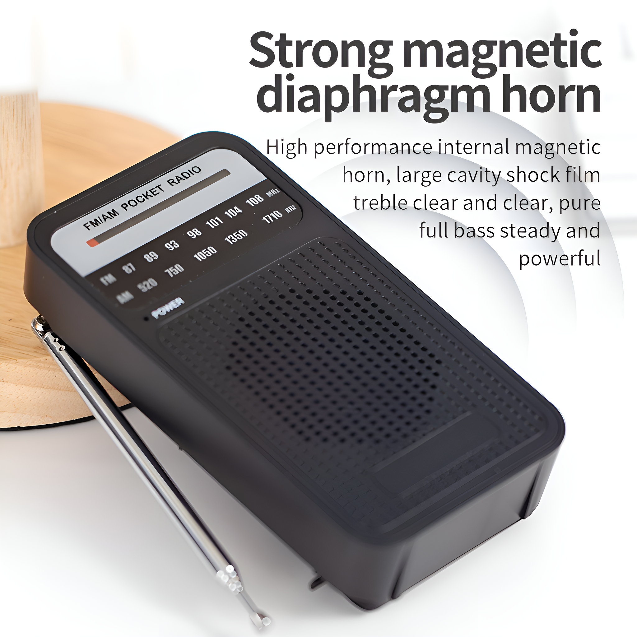 Schwarzes FM/AM-Taschenradio mit ausgefahrener Antenne. Text: 'Starkes magnetisches Membranhorn'.