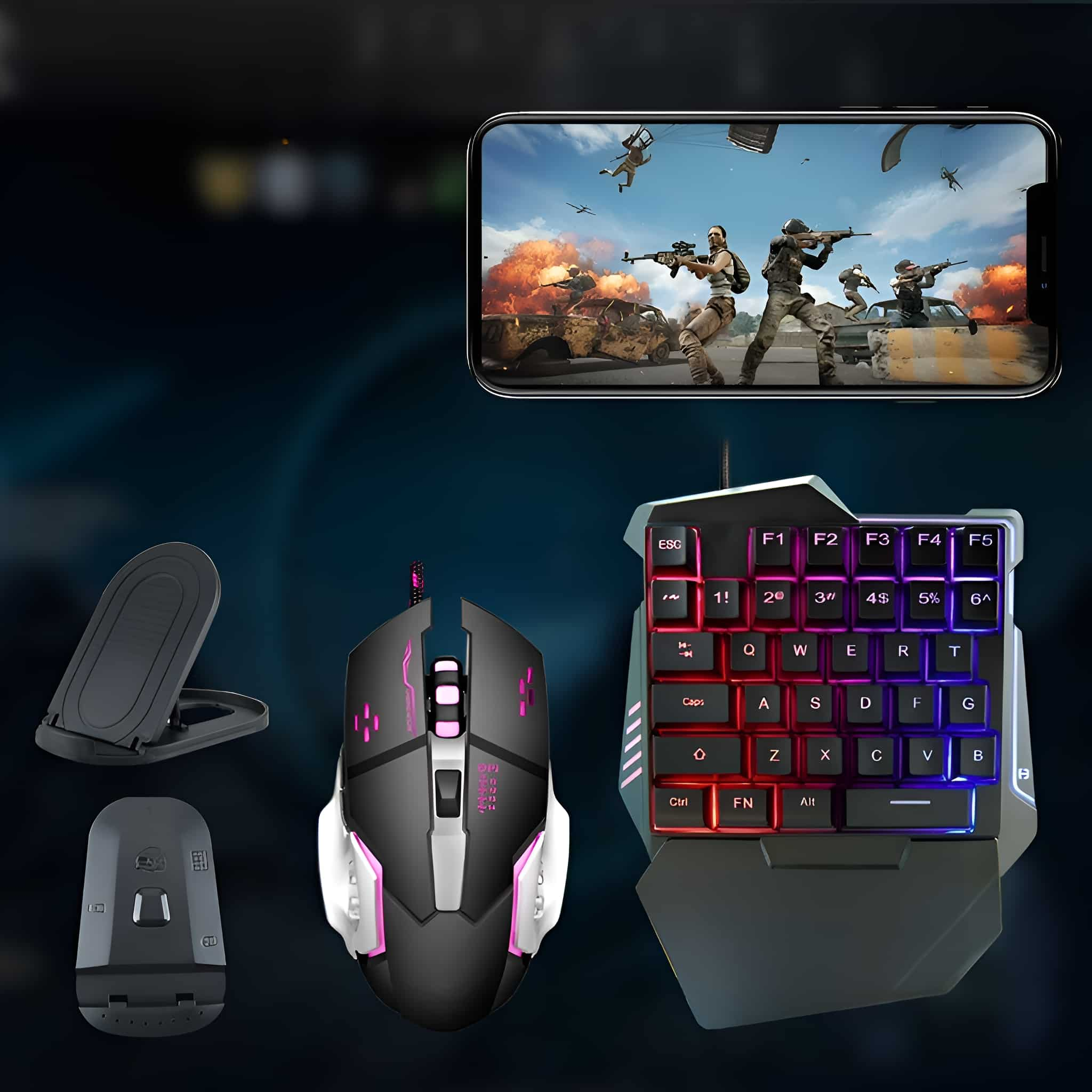 Gaming-Setup: Maus, Tastatur und Telefon mit Spiel auf dem Bildschirm. Schwarze und farbige Akzente.