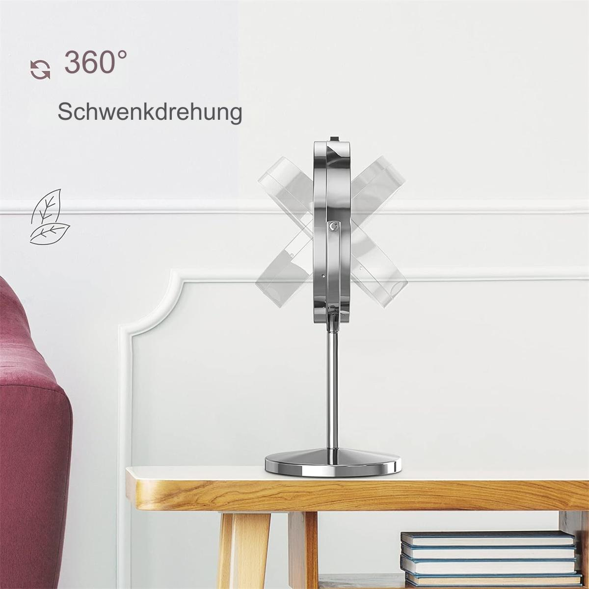 Silberner, faltbarer Spiegel auf einem Tisch. Text auf Deutsch.