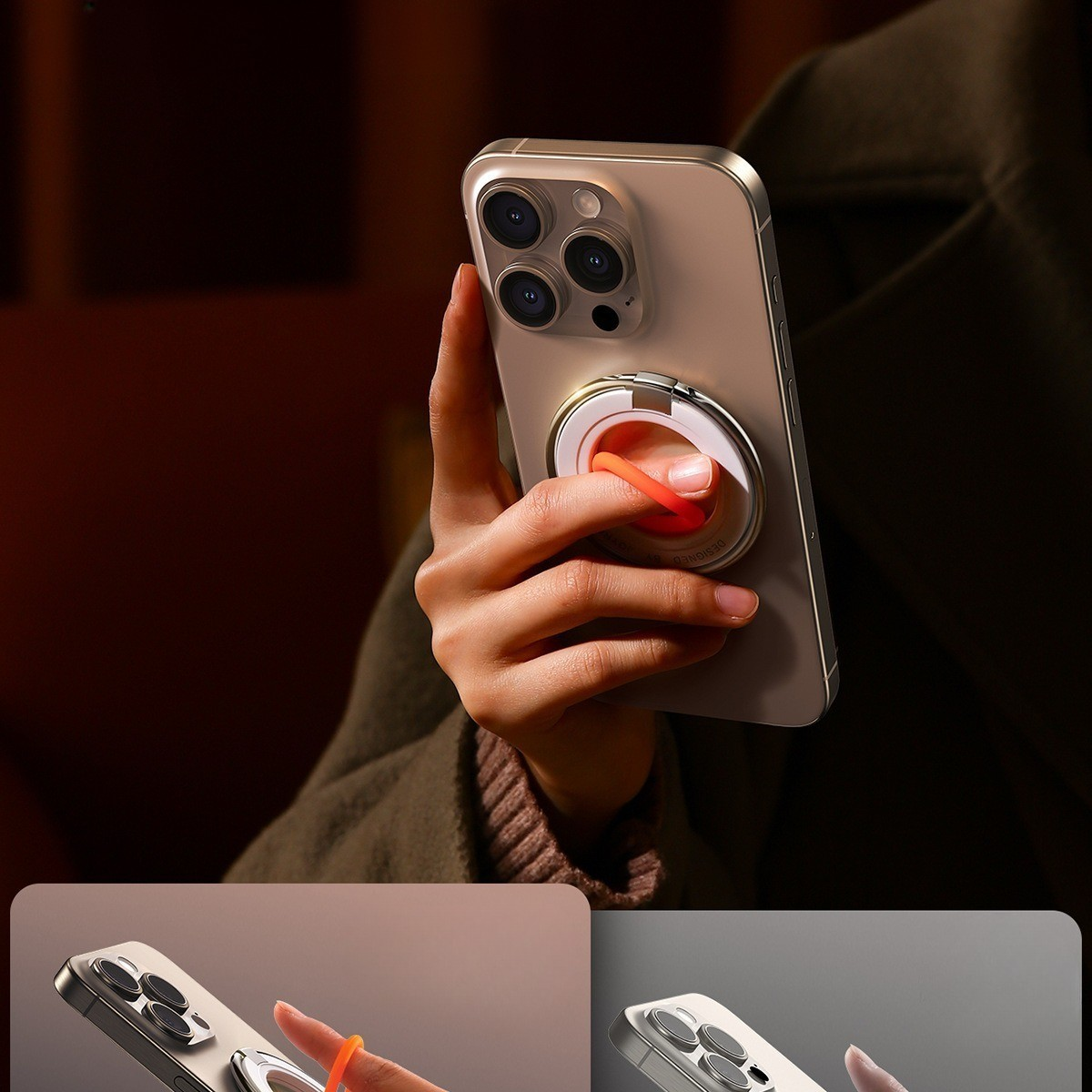 Goldenes Telefon mit orangefarbenem Ringhalter. Hand hält das Telefon.
