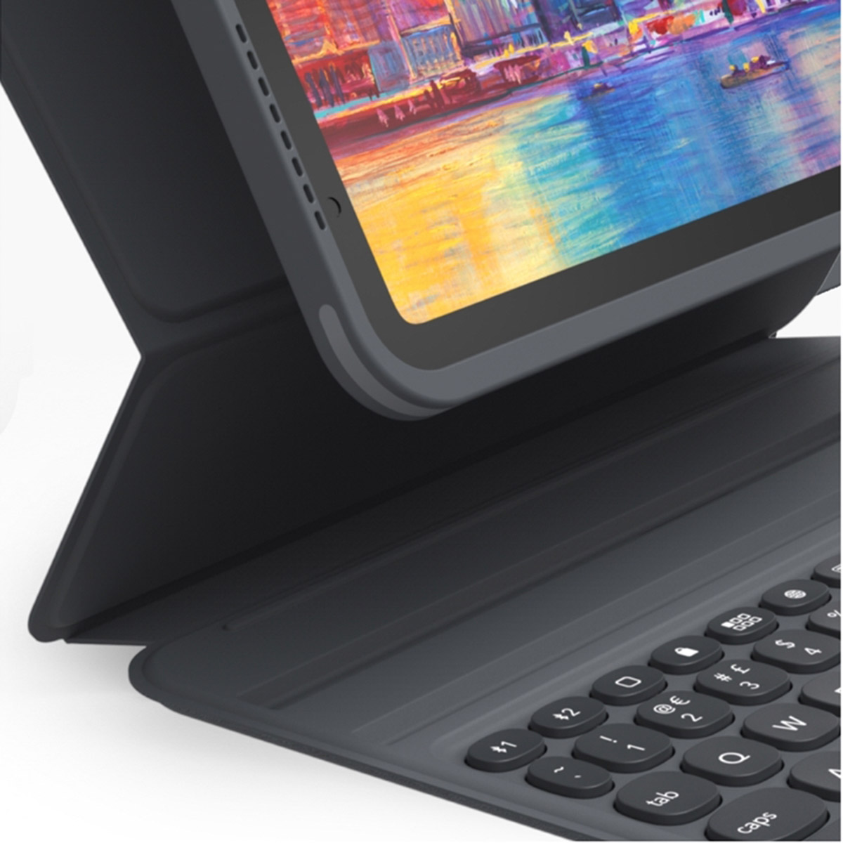 Una funda de tableta gris oscuro con teclado está abierta, mostrando un paisaje urbano colorido.