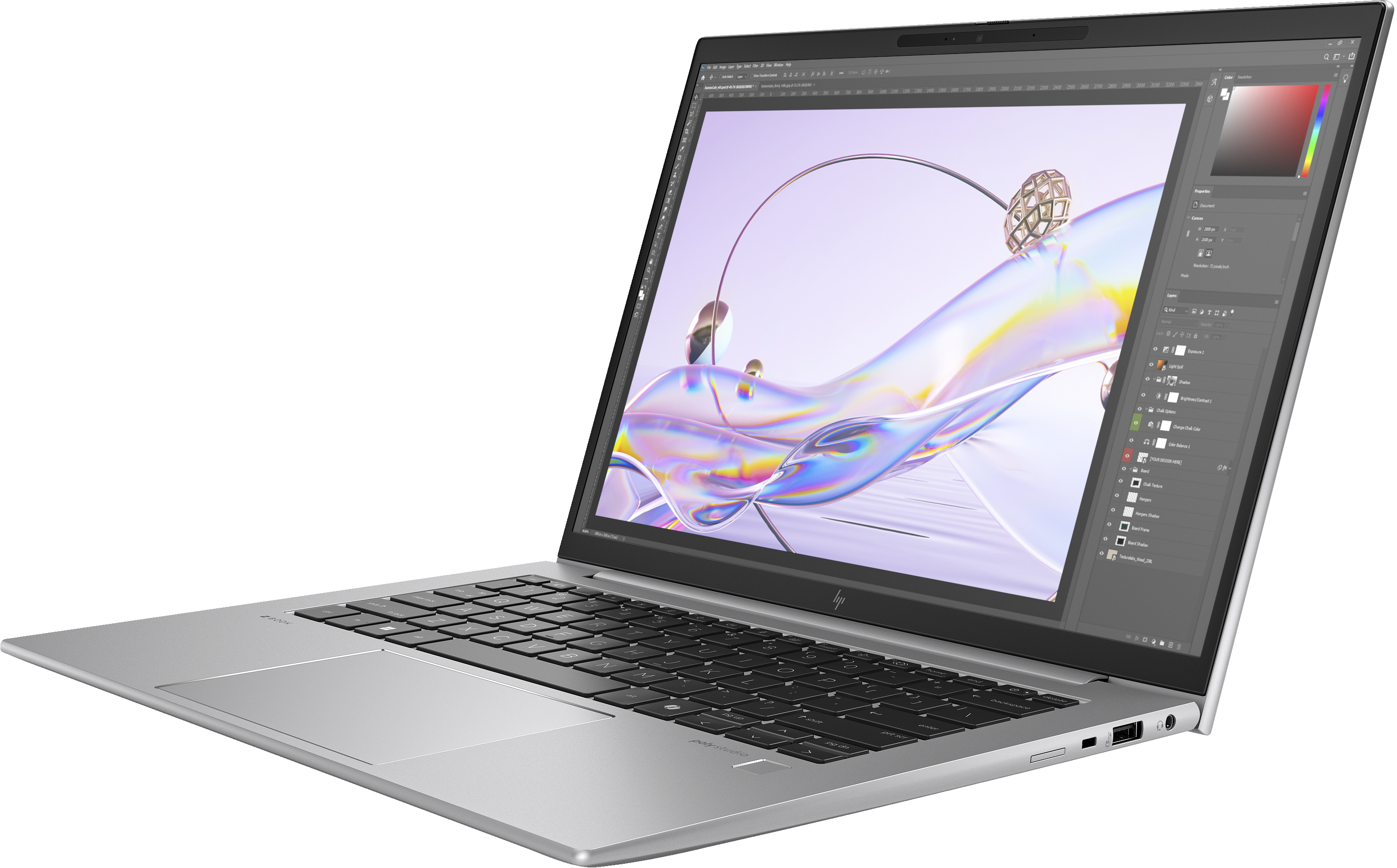 Un laptop argentato che mostra un'interfaccia software di editing immagini sul suo schermo.