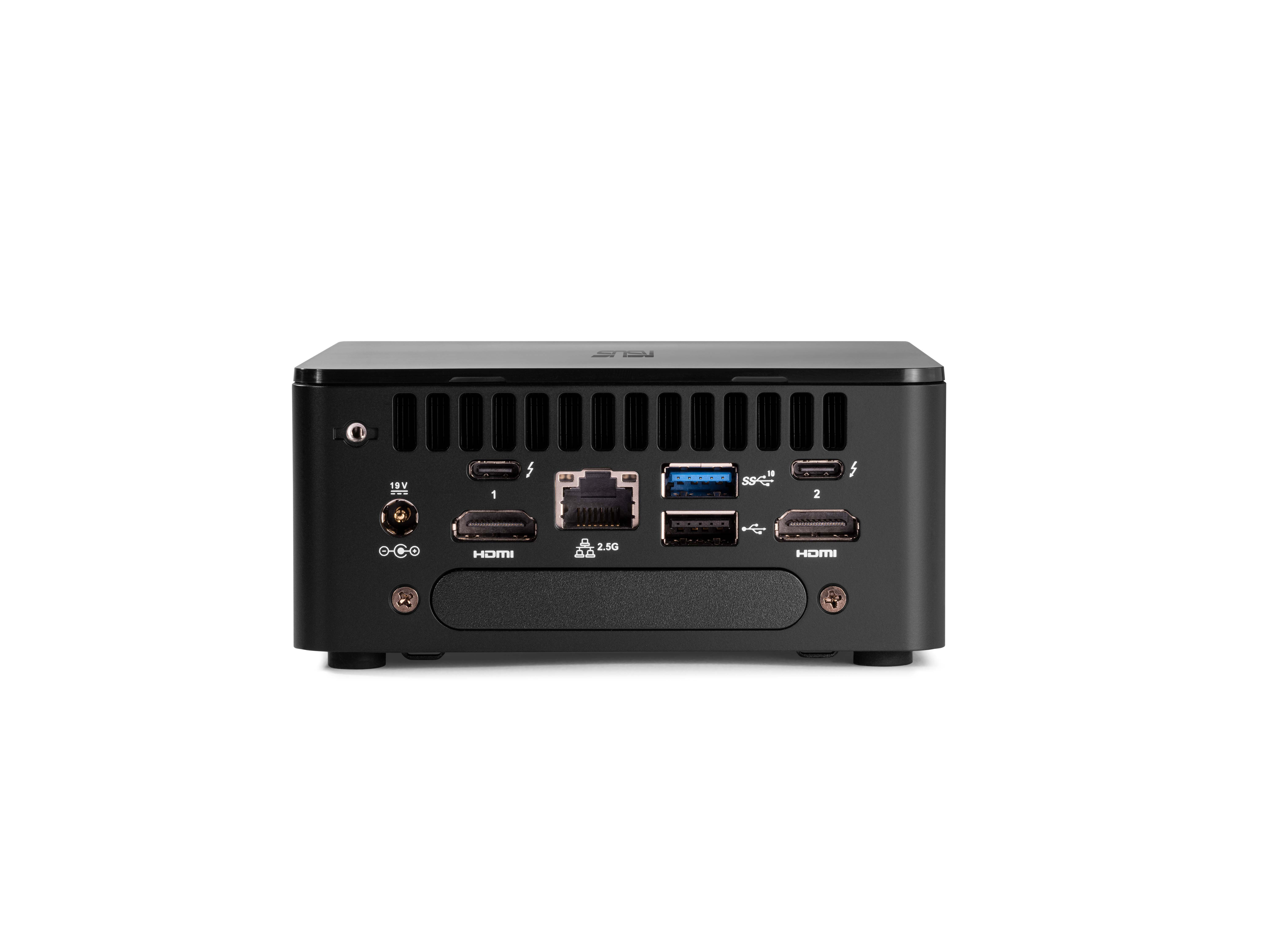 Un mini PC nero con più porte sul retro, posizionato su una superficie bianca.