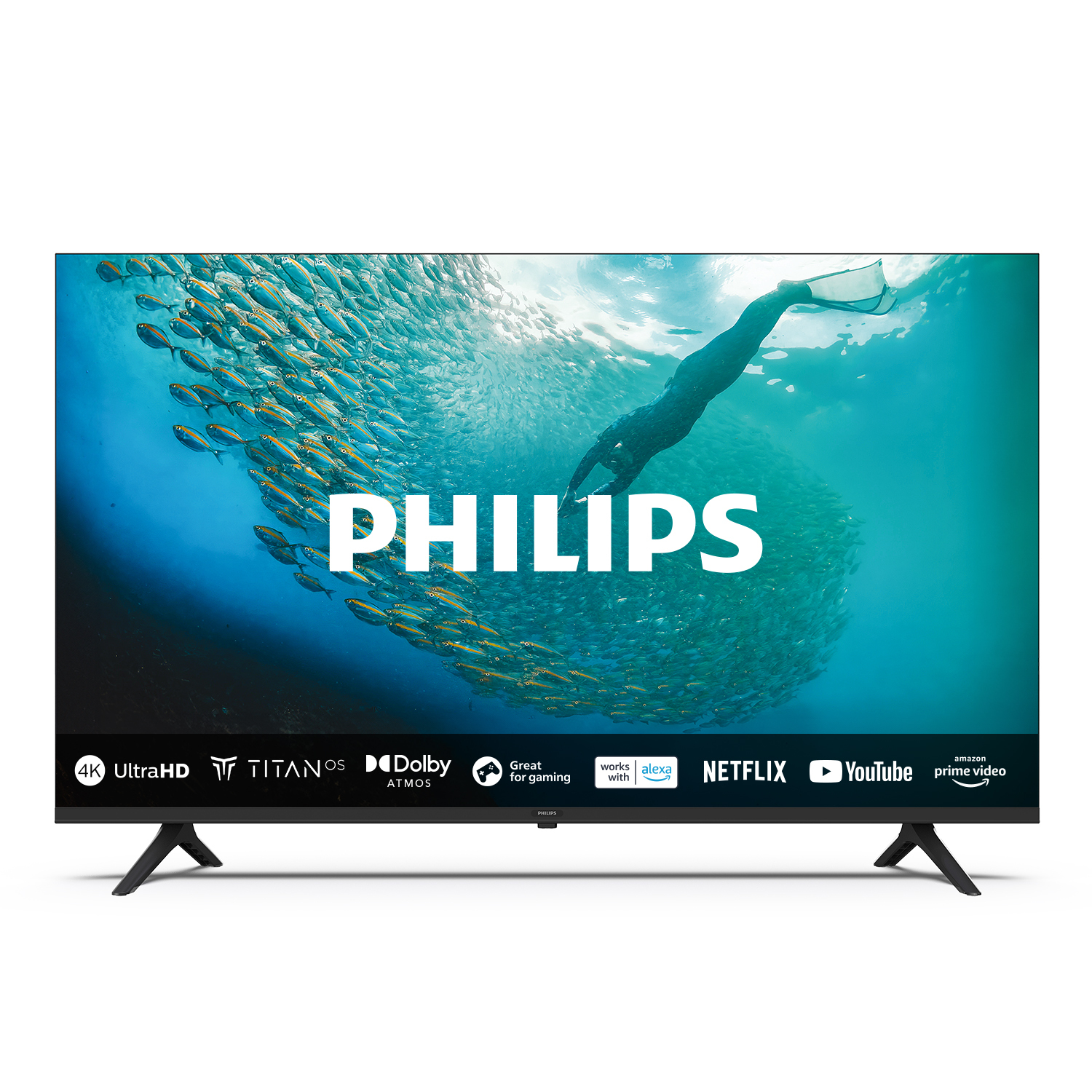 Un grande televisore Philips su sfondo bianco. Una persona sullo sfondo.