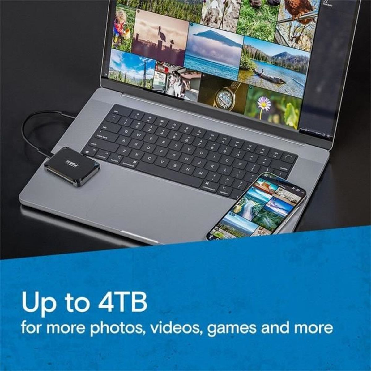 Laptop z dyskiem twardym i smartfonem wyświetlającym zdjęcia.