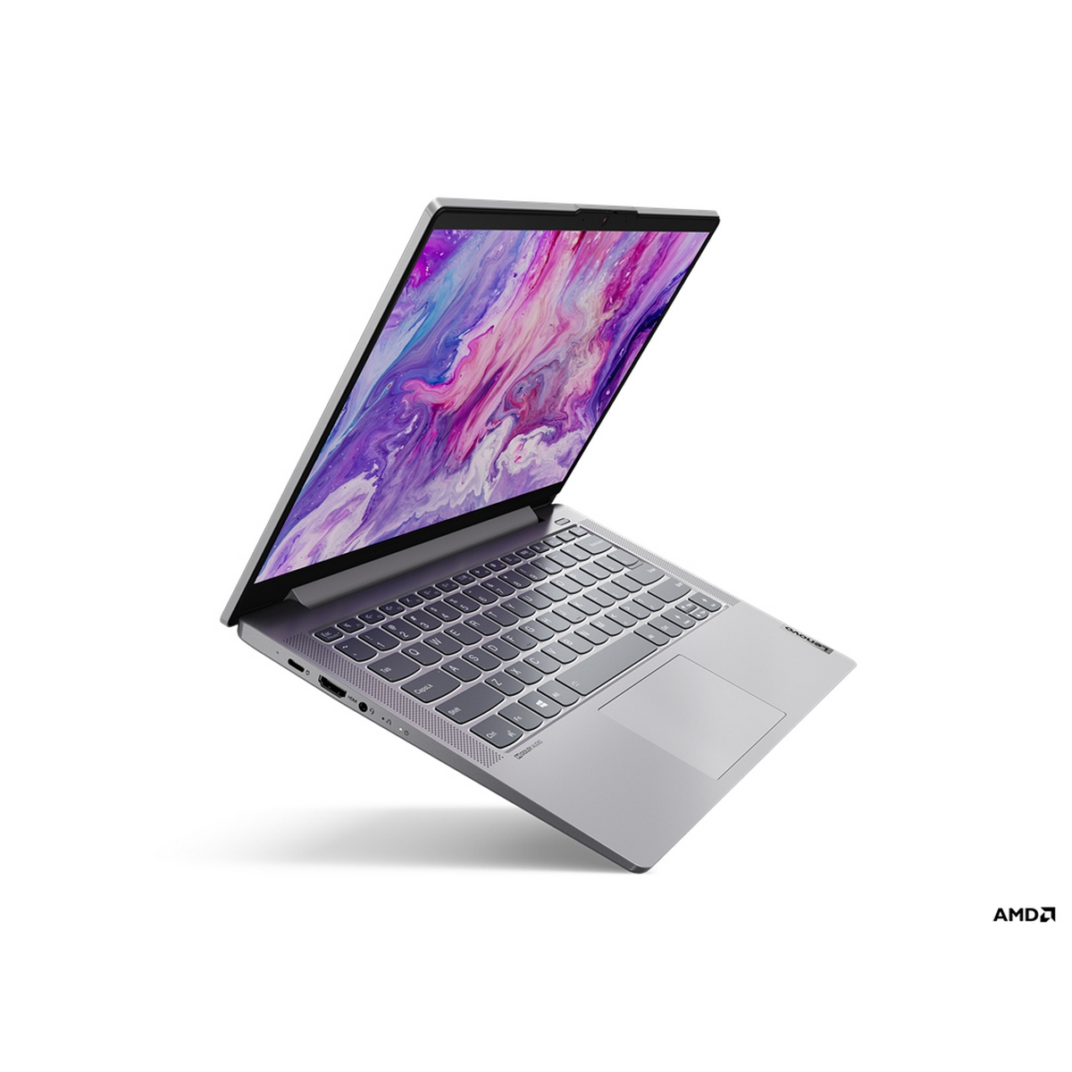 Laptop, aperto, vista angolata, che mostra un'immagine astratta colorata, logo AMD.
