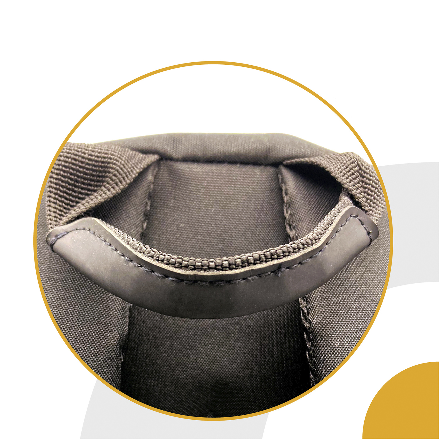 Primer plano de un asa de mochila de color oscuro con un agarre negro.