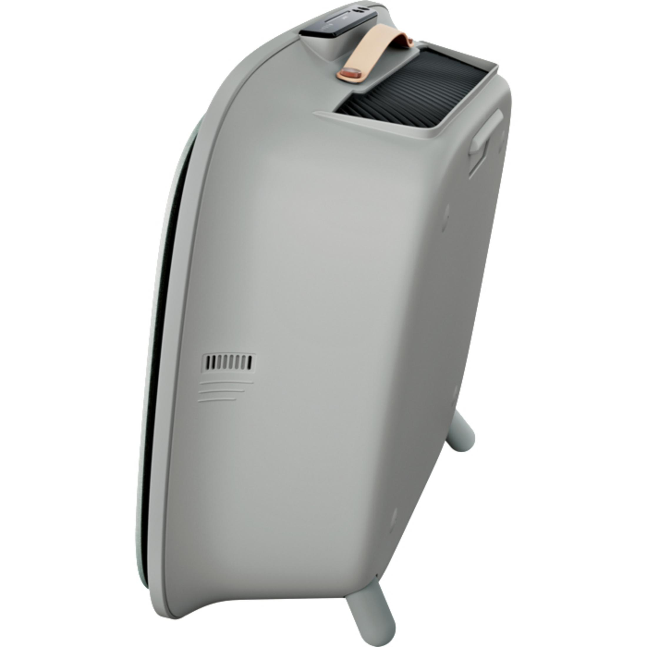 Purificatore d'aria grigio con maniglia e gambe. Il lato ha una presa d'aria. Il dispositivo è su bianco.