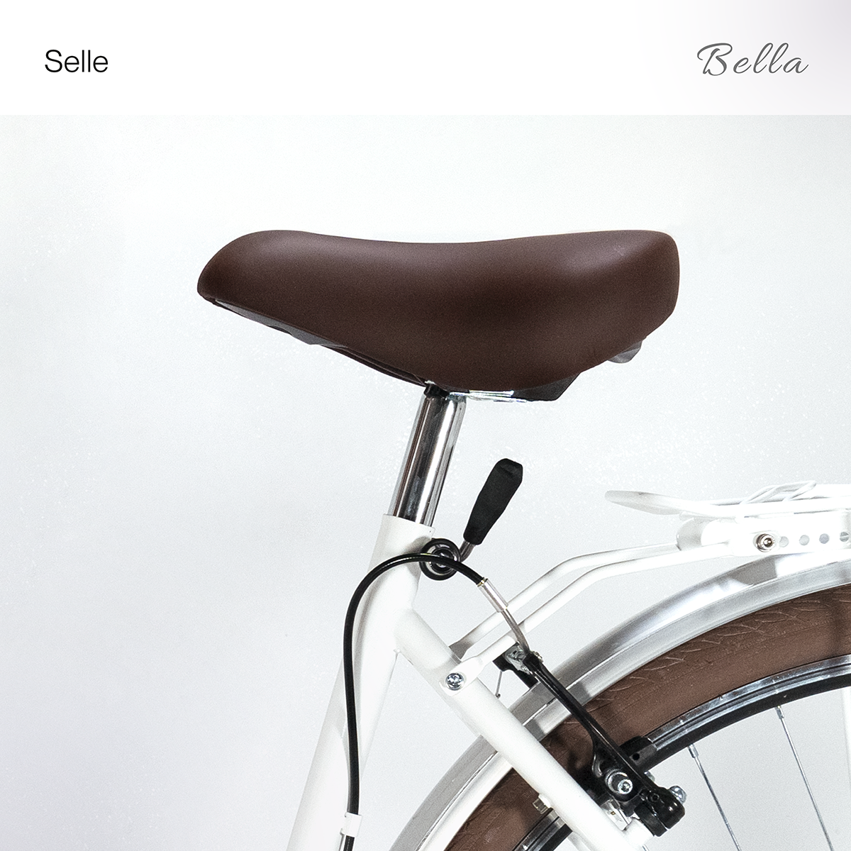 Brauner Fahrradsattel auf weißem Rahmen, mit braunem Reifen.