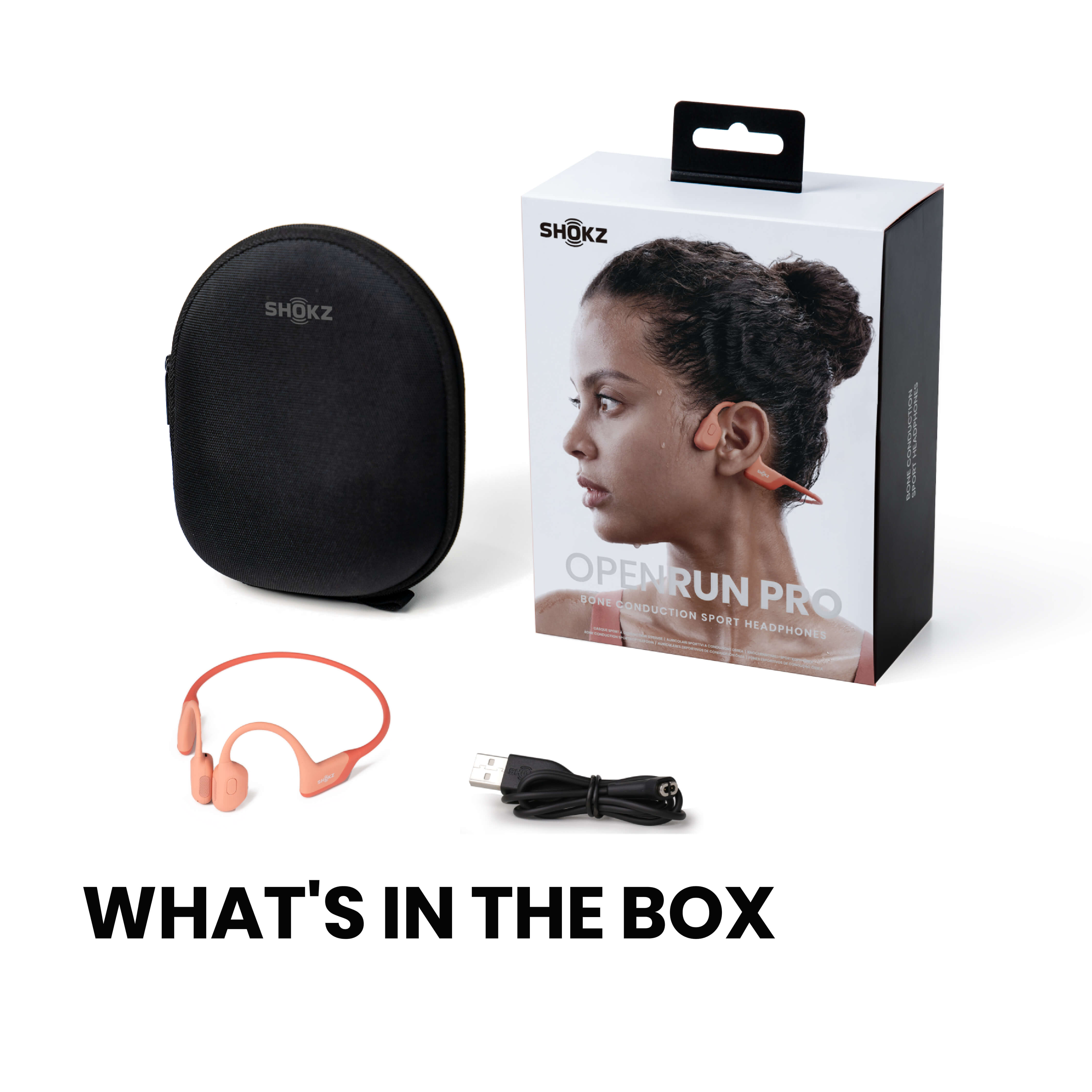 Una scatola con cuffie, una custodia e un cavo di ricarica con l'etichetta “WHAT'S IN THE BOX”.
