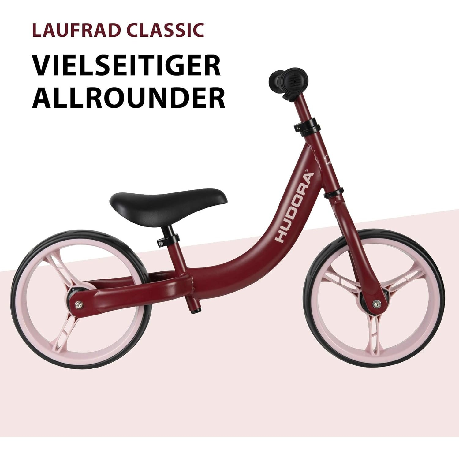 Rotes Laufrad mit rosa Rädern und schwarzem Sitz, weißer Hintergrund, Text oben.
