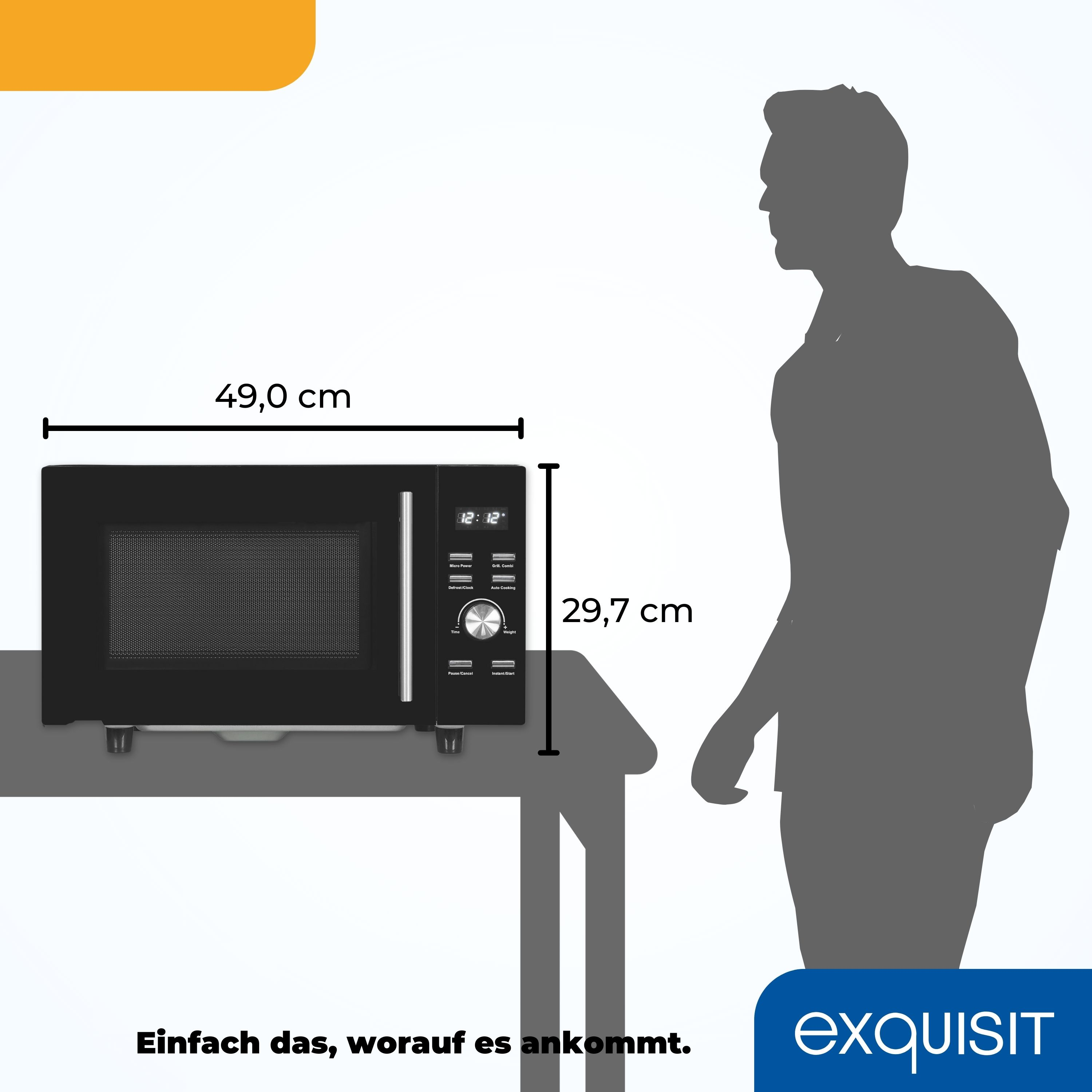 Schwarze Mikrowelle auf einem Tisch. Abmessungen: 49,0 cm breit und 29,7 cm hoch. Rechts eine Person als Silhouette.