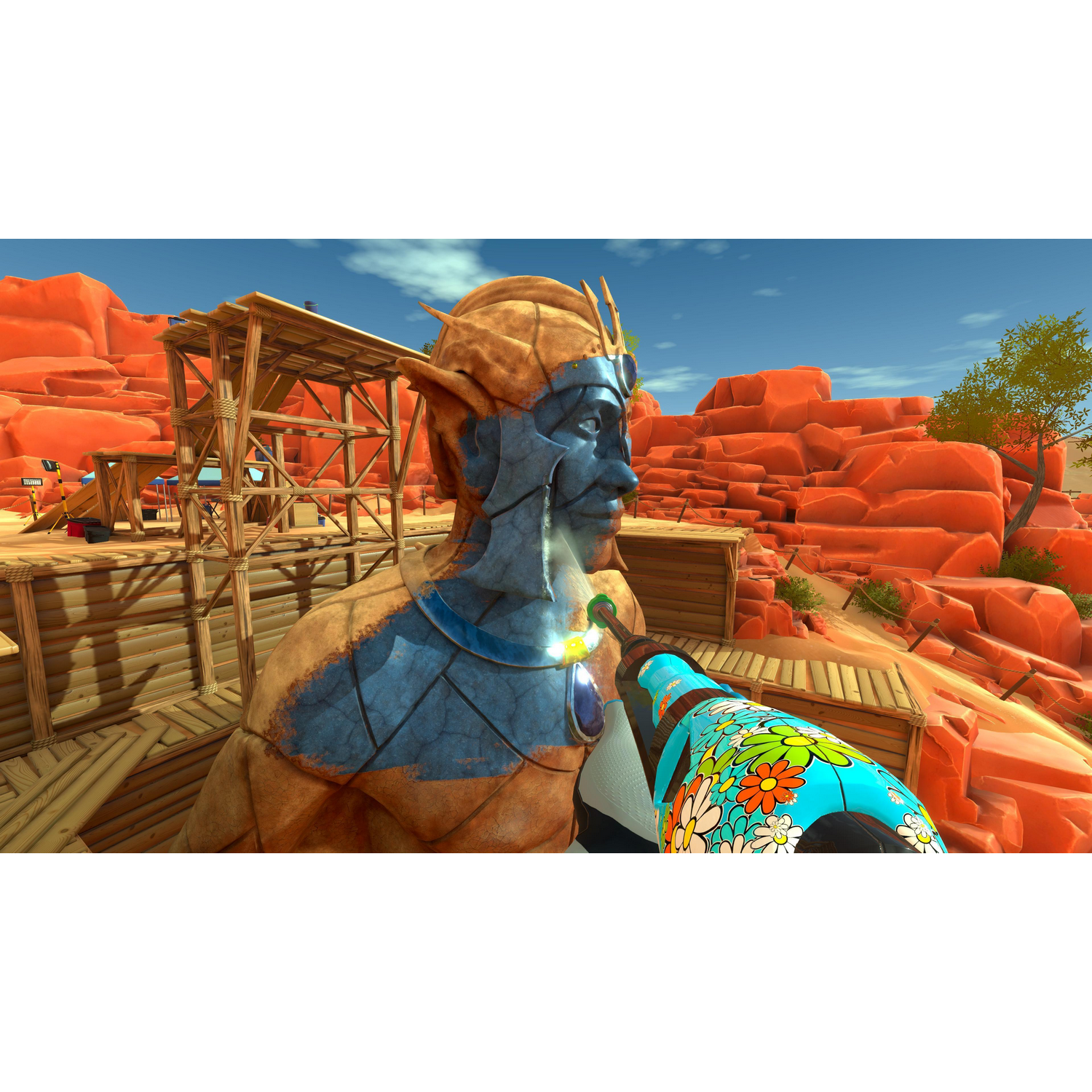 Posąg z niebieską farbą na twarzy jest obrabiany kolorowym narzędziem.