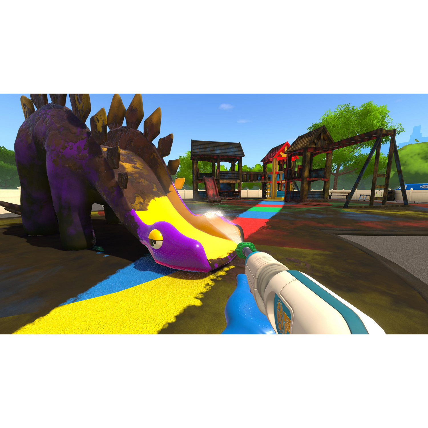 Gracz używa pistoletu na wodę na zjeżdżalni, dinozaurze i innych konstrukcjach z kolorową farbą.