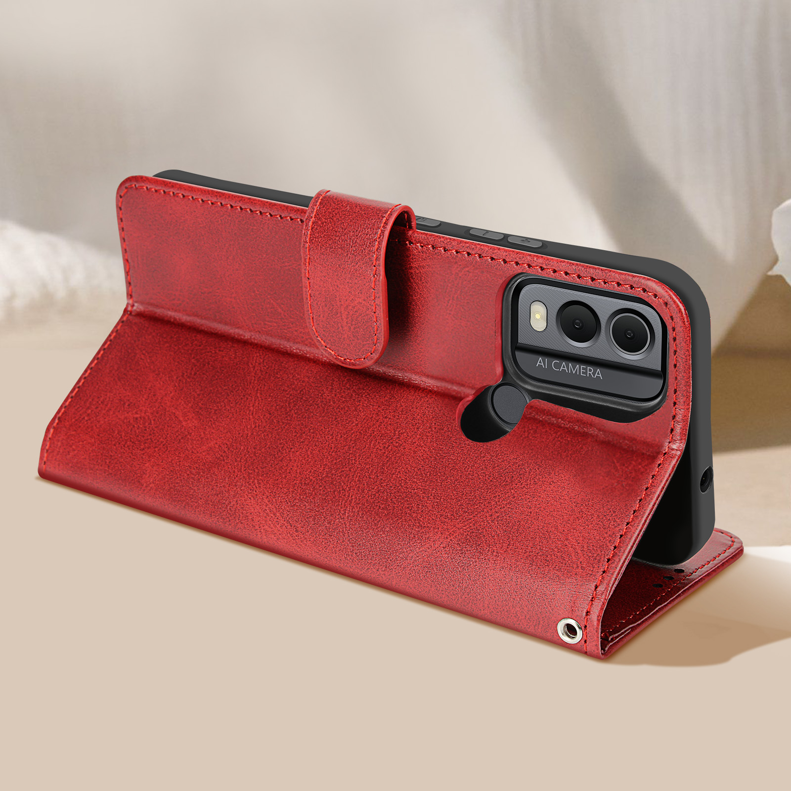 Custodia per telefono in pelle rossa, aperta, che mostra telefono e fotocamera, con interno nero.