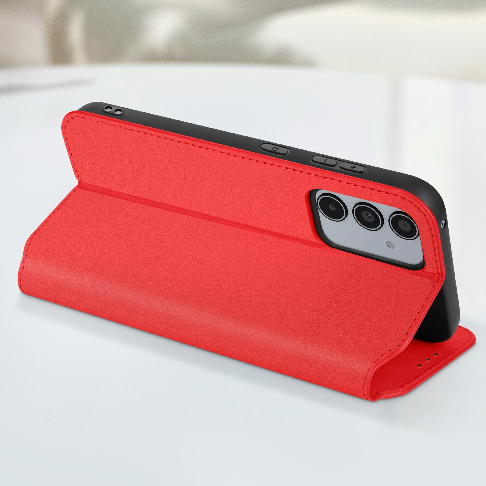 Una custodia per telefono rossa con un telefono all'interno, la custodia aperta per mostrare lo schermo del telefono.