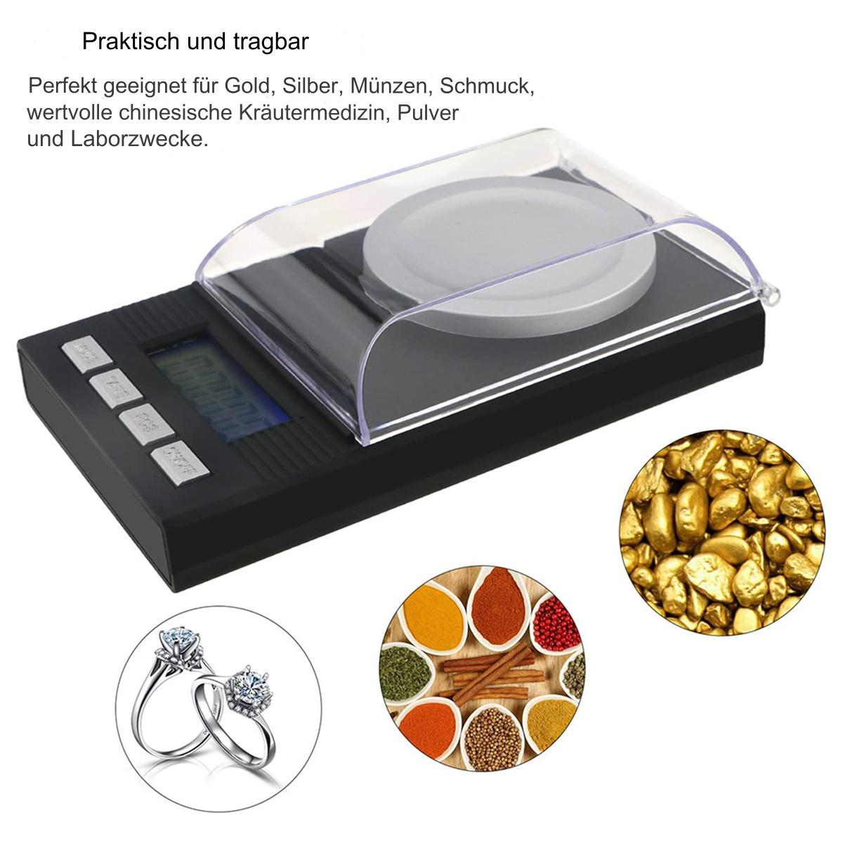 Waage mit transparenter Abdeckung, mit Bildern von Gold, Gewürzen, Schmuck. Schwarzer Hintergrund.